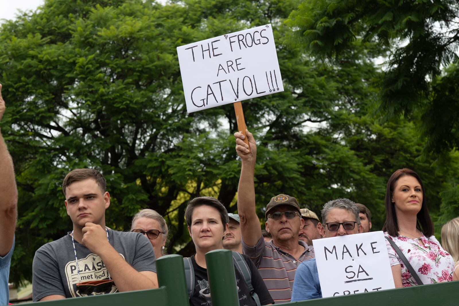 White South Africans demonstrate in support of U.S. President Donald Trump in front of the U.S. embassy in Pretoria, South Africa, Saturday, Feb. 15, 2025. (AP Photo/Jerome Delay)