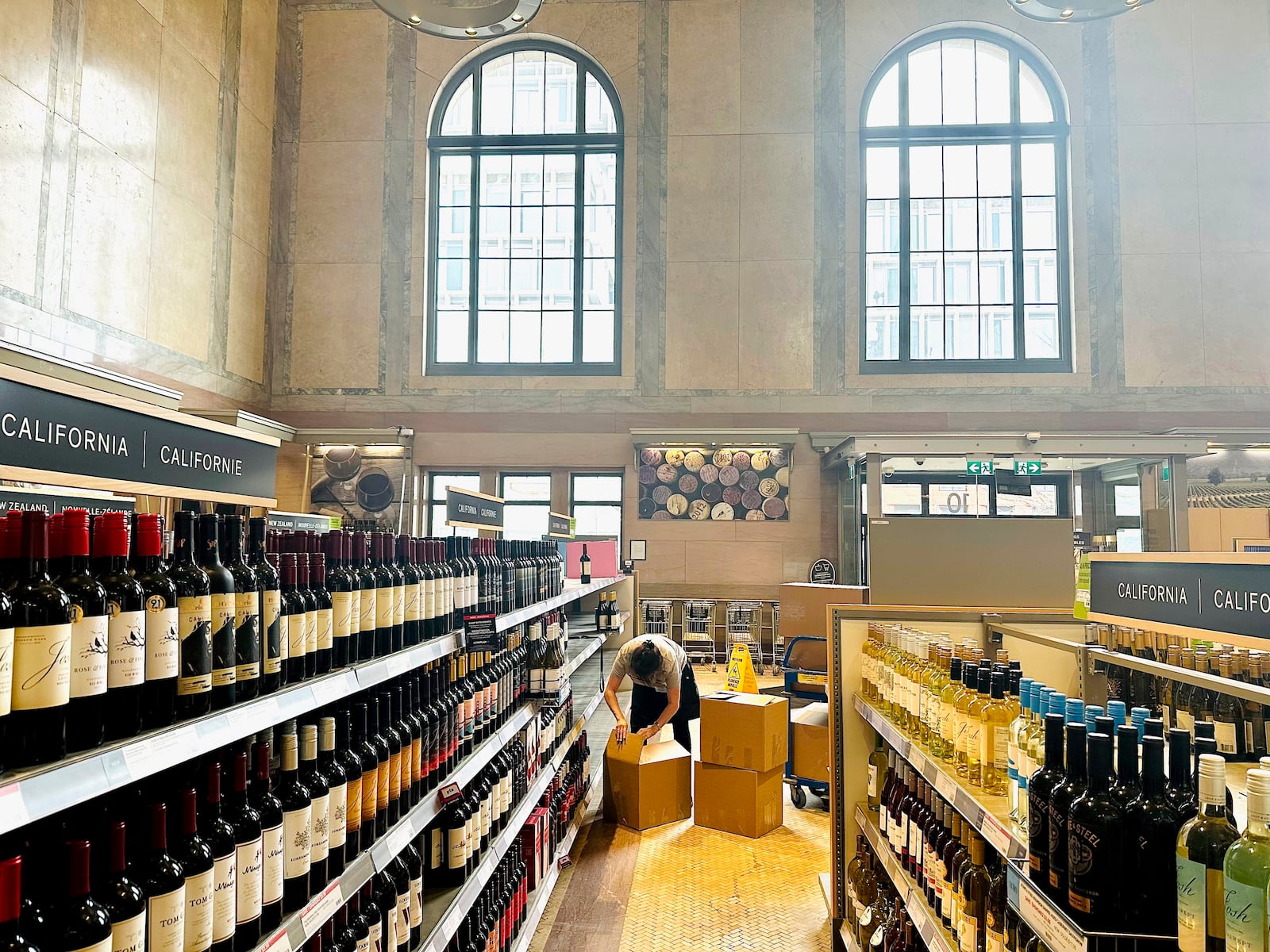 An employee boxes up American products at an LCBO outlet in Toronto on Tuesday, March 4, 2025. (Chris Young/The Canadian Press via AP)