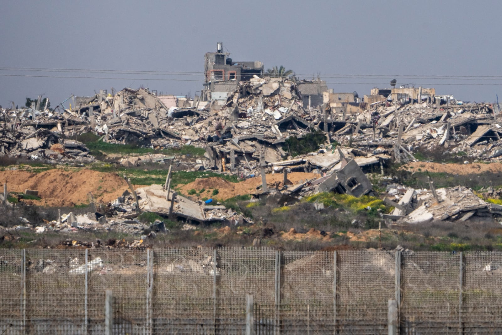 Destroyed buildings by Israeli bombardments in the northern Gaza Strip as seen from southern Israel, Wednesday, March 5, 2025. (AP Photo/Ariel Schalit)