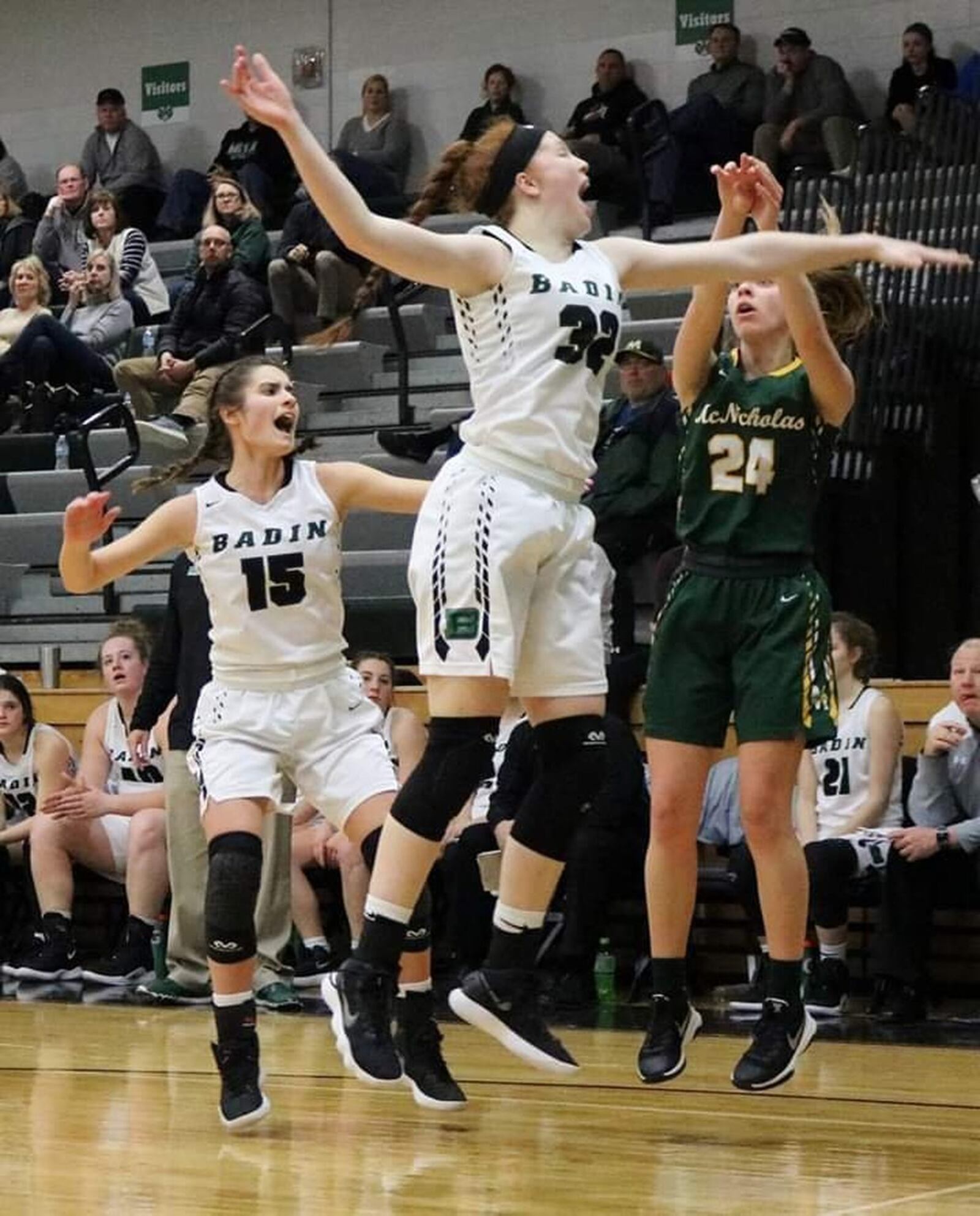 Badin’s Mickayla Kowalski (32) and Grace Larkin (15) defend Julia Brune of McNicholas during Wednesday night’s game at Mulcahey Gym in Hamilton. McNick won 53-51. CONTRIBUTED PHOTO BY TERRI ADAMS