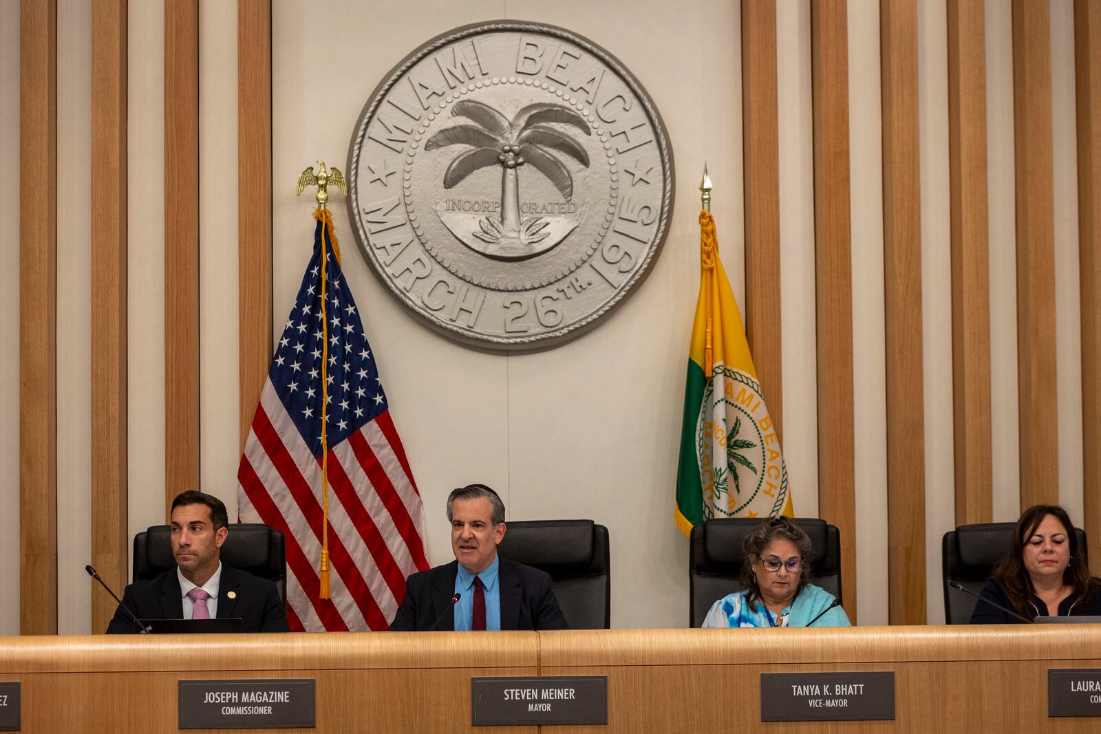 Miami Beach Mayor Steven Meiner, second from left, speaks to a full Miami Beach Commission Chambers on a proposal to terminate a lease and cut financial support for O Cinema, the independent film theater on Wednesday, March 19, 2025 in Miami Beach, Fla. (Jose Iglesias /Miami Herald via AP)