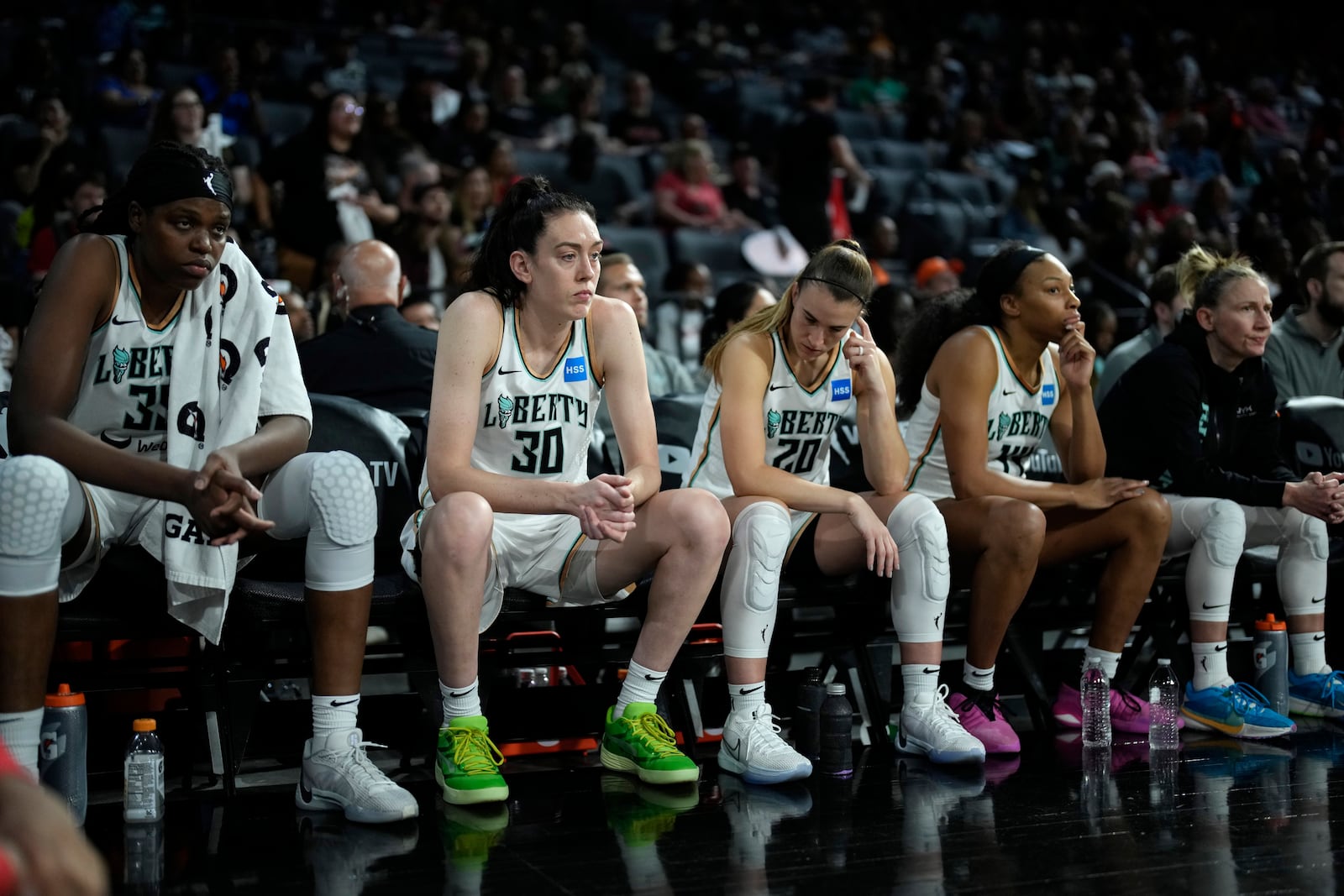 FILE - New York Liberty players sit on the bench as they trail the Las Vegas Aces in the final minute during the second half in Game 2 of a WNBA basketball final playoff series, Oct. 11, 2023, in Las Vegas. (AP Photo/John Locher, File)