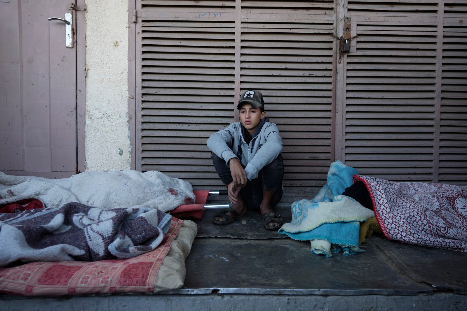 A Palestinian youth mourns nine people killed in an Israeli strike in Bureij refugee camp, Gaza Strip, Friday, Nov. 15, 2024. (AP Photo/Abdel Kareem Hana)