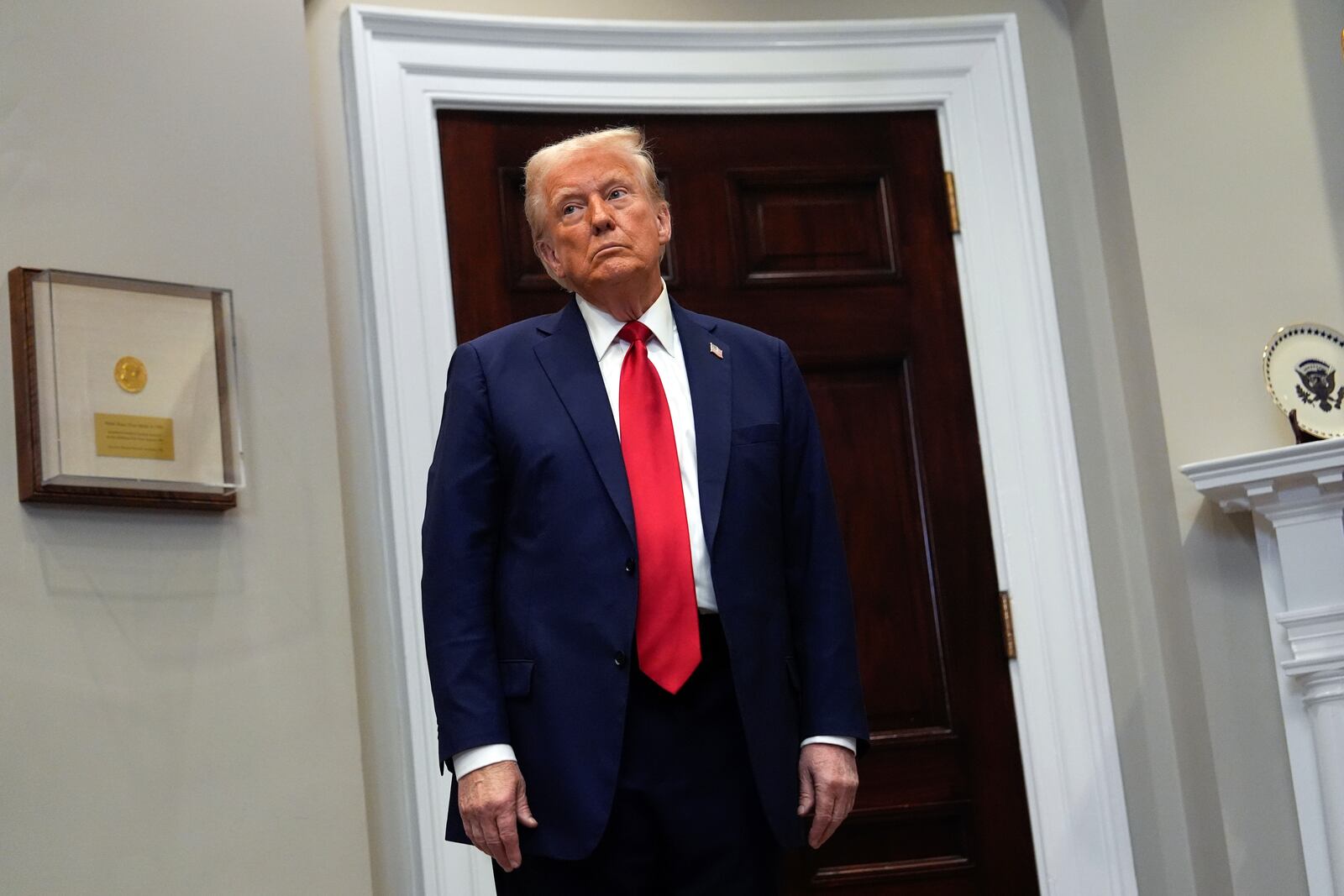 President Donald Trump listens in the Roosevelt Room at the White House, Tuesday, Jan. 21, 2025, in Washington. (AP Photo/Julia Demaree Nikhinson)