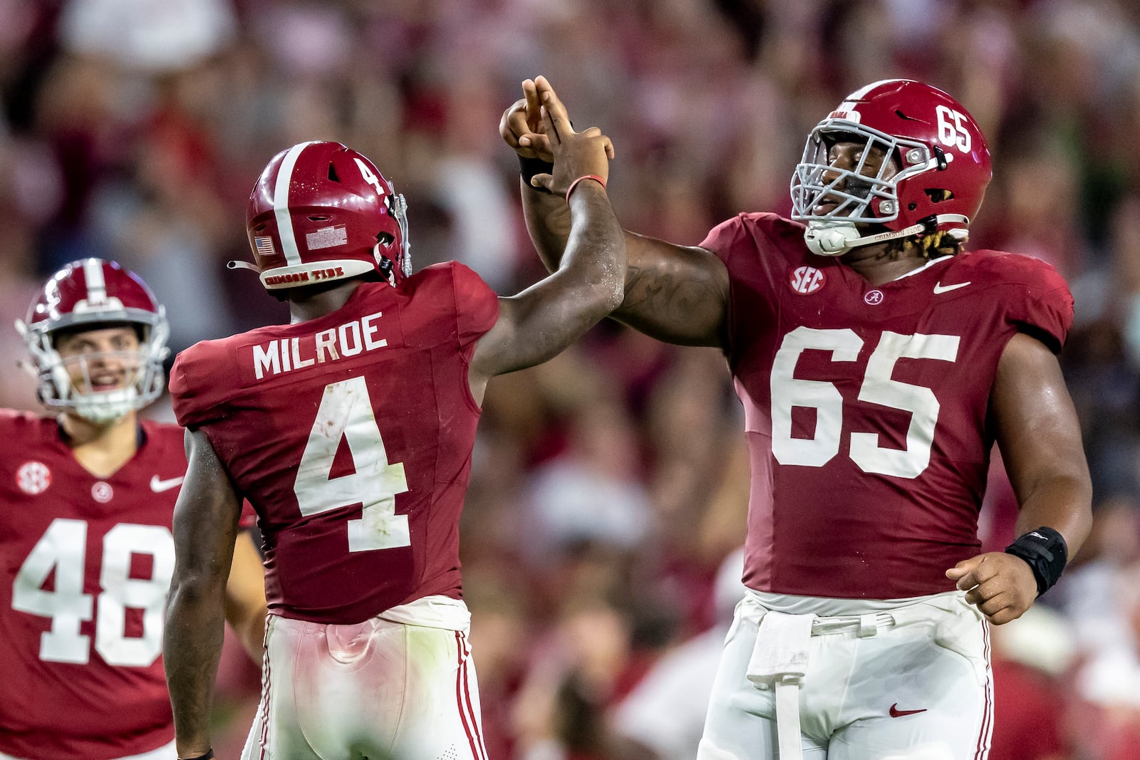 Alabama quarterback Jalen Milroe (4) celebrates with offensive lineman JC Latham (65) after a 48-yard touchdown pass against Middle Tennessee during the second half an NCAA college football game Saturday, Sept. 2, 2023, in Tuscaloosa, Ala. (AP Photo/Vasha Hunt)