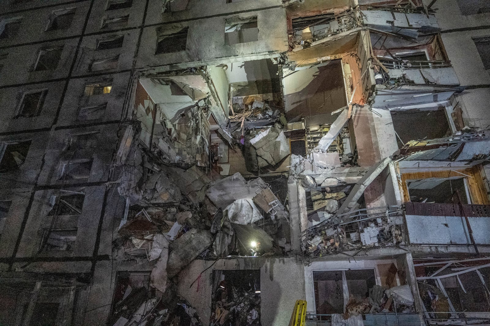 A multi-storey apartment building is seen damaged by the Russian attack in Kharkiv, Ukraine, late Wednesday, Oct. 30, 2024. (AP Photo/Andrii Marienko)