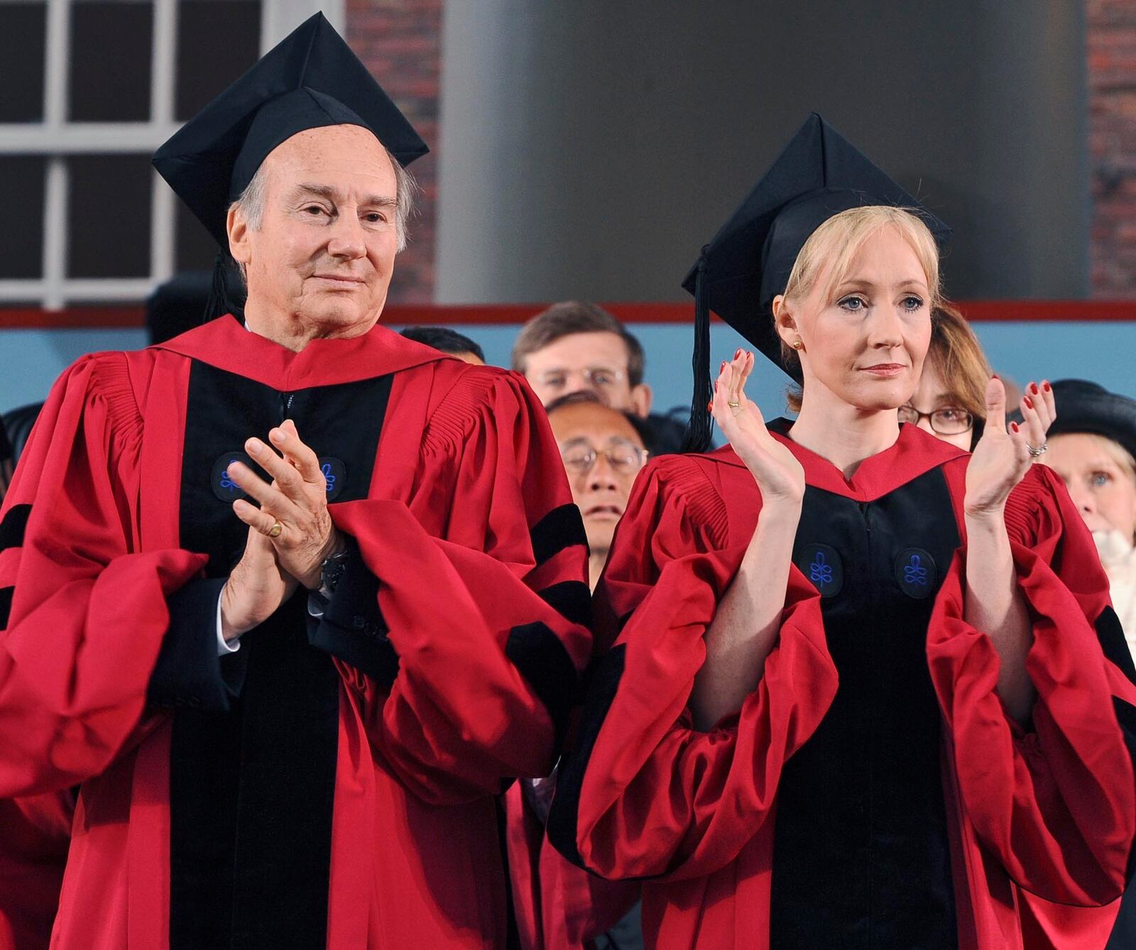 FILE - The Aga Khan, left, and author J.K. Rowling, right, clap during Harvard University commencement exercises, Thursday, June 5, 2008, in Cambridge, Mass. Both received honorary degrees during the exercises. (AP Photo/Lisa Poole, File)