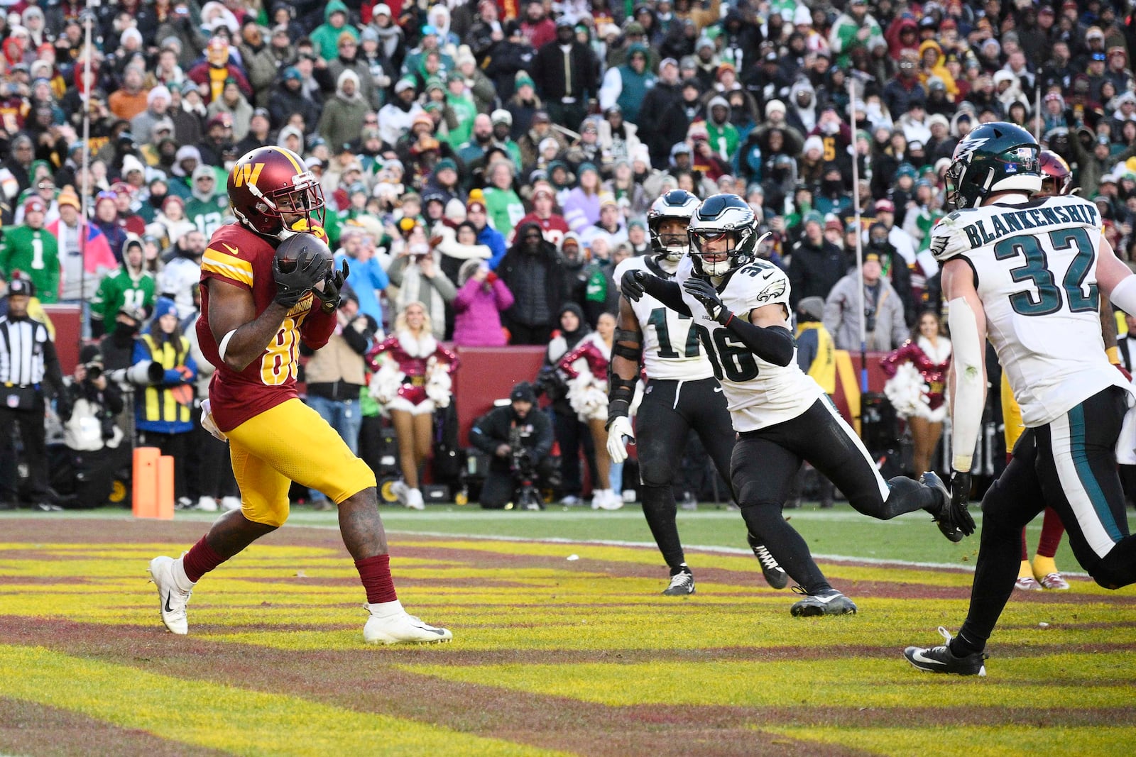 Washington Commanders wide receiver Jamison Crowder (80) makes a catch for a touchdown against the Philadelphia Eagles during the second half of an NFL football game, Sunday, Dec. 22, 2024, in Landover, Md. (AP Photo/Nick Wass)