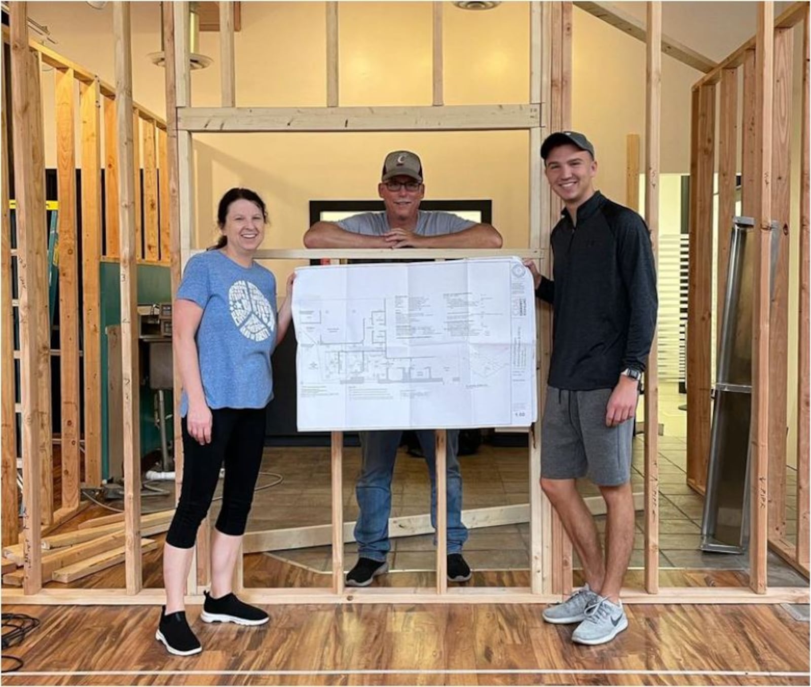 Luke Heizer, right, plans to open Luke's Custom Cakes on High Street in the former True West Coffee location (True West's Main Street shop remains open). His mother, Tammie, and father, Alan, are helping with the project. PROVIDED