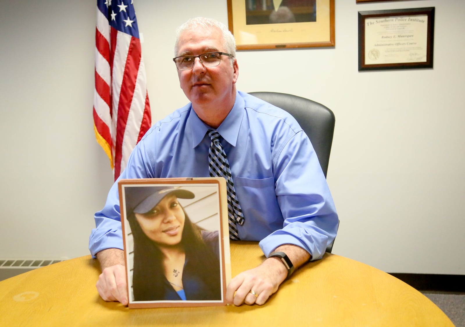 Middletown Police Chief Rodney Muterspaw with a photo of Teresa Shields, who was killed Jan. 1, 2017, when she was a passenger in a car that was leaving a New Year’s Eve party at 513 Lounge on Verity Parkway.