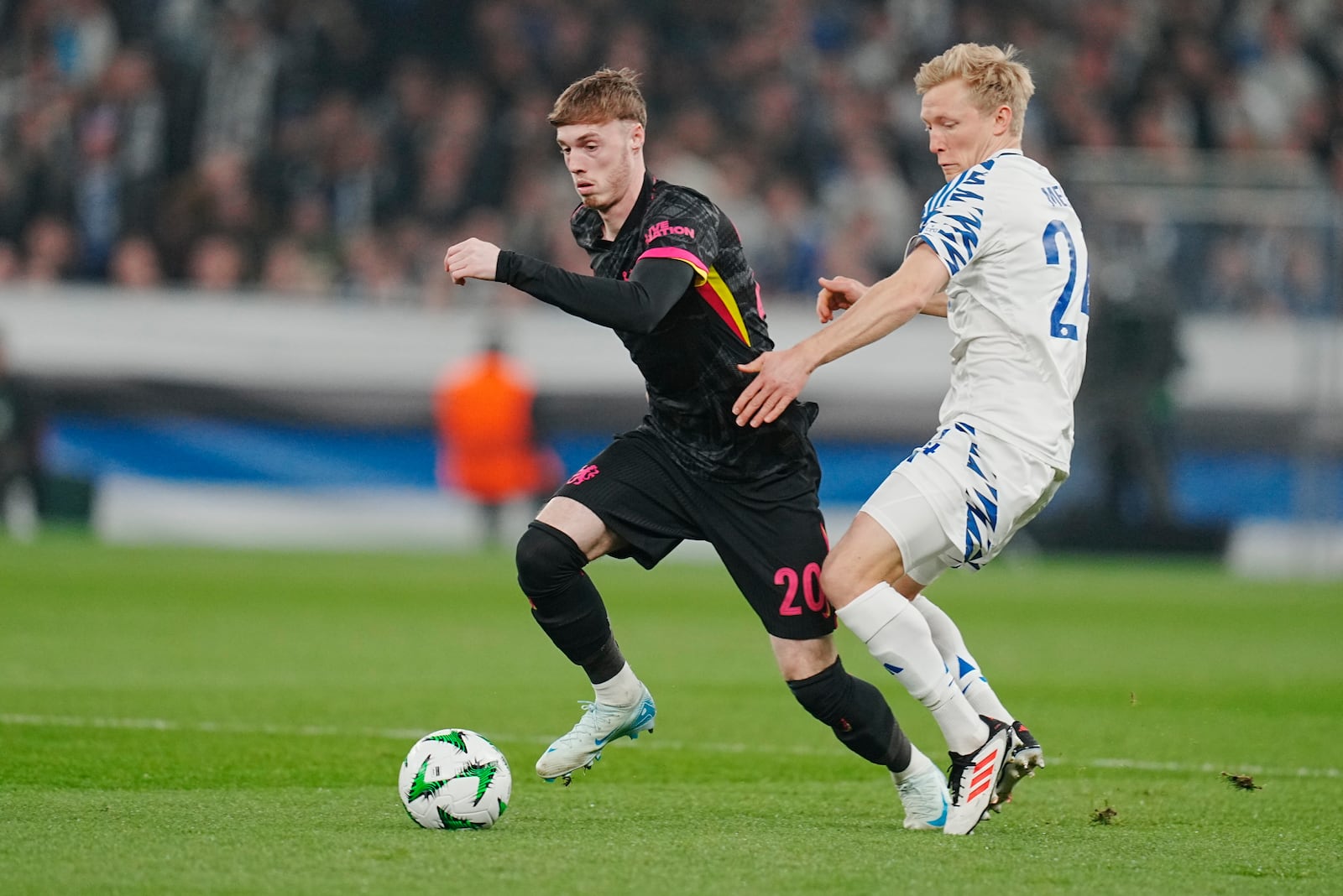 Chelsea's Cole Palmer, left, and Copenhagen's Birger Meling in action during the Conference League round of 16 soccer match between FC Copenhagen and Chelsea FC at Parken Stadium in Copenhagen, Denmark, Thursday March 6, 2025. (Liselotte Sabroe/Ritzau Scanpix via AP)