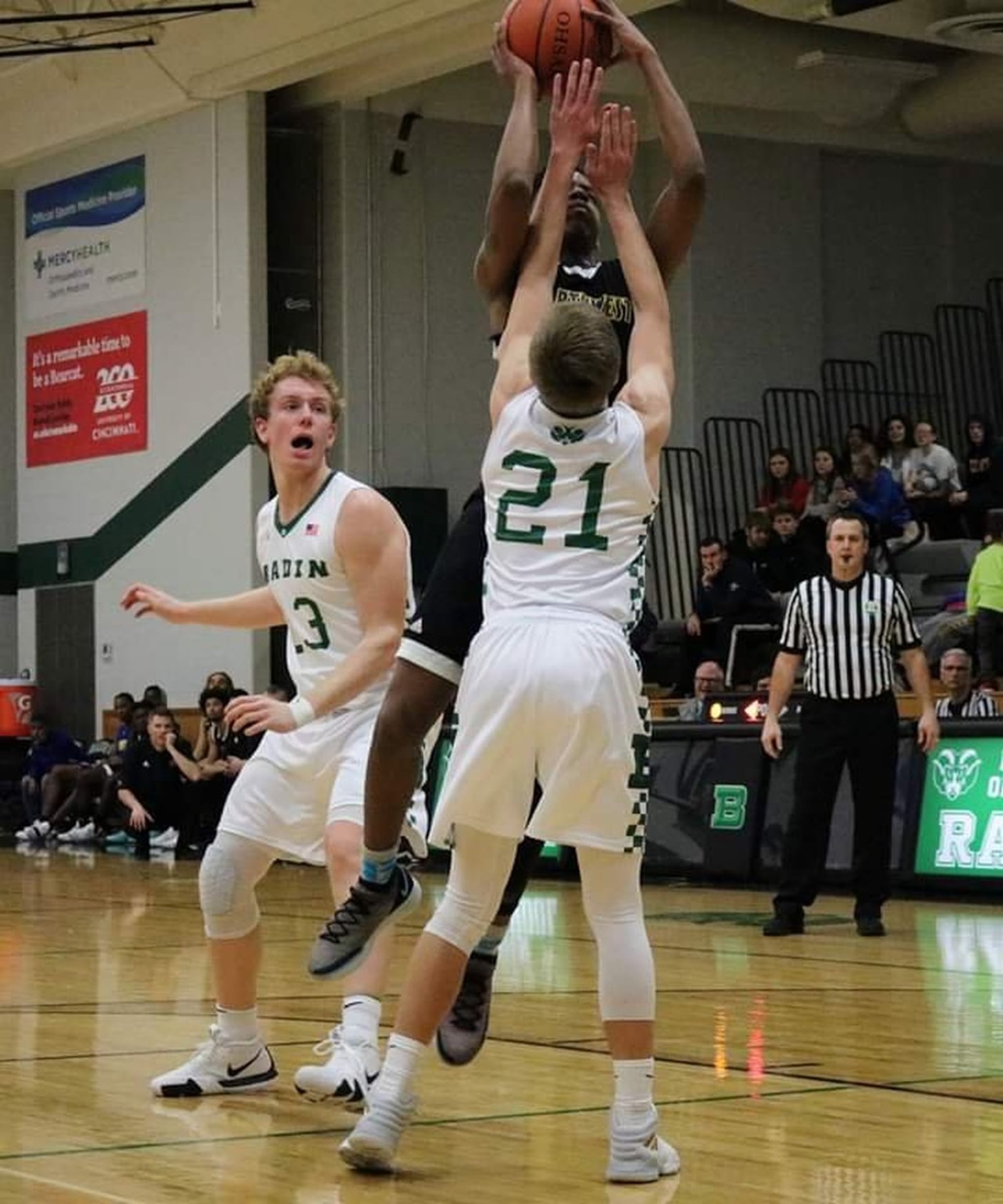 Northwest’s Tyre McKinney (3) gets a shot off between Badin’s Justin Pappas (13) and Josh Hegemann (21) during Tuesday night’s game at Mulcahey Gym in Hamilton. Badin won 70-52. CONTRIBUTED PHOTO BY TERRI ADAMS