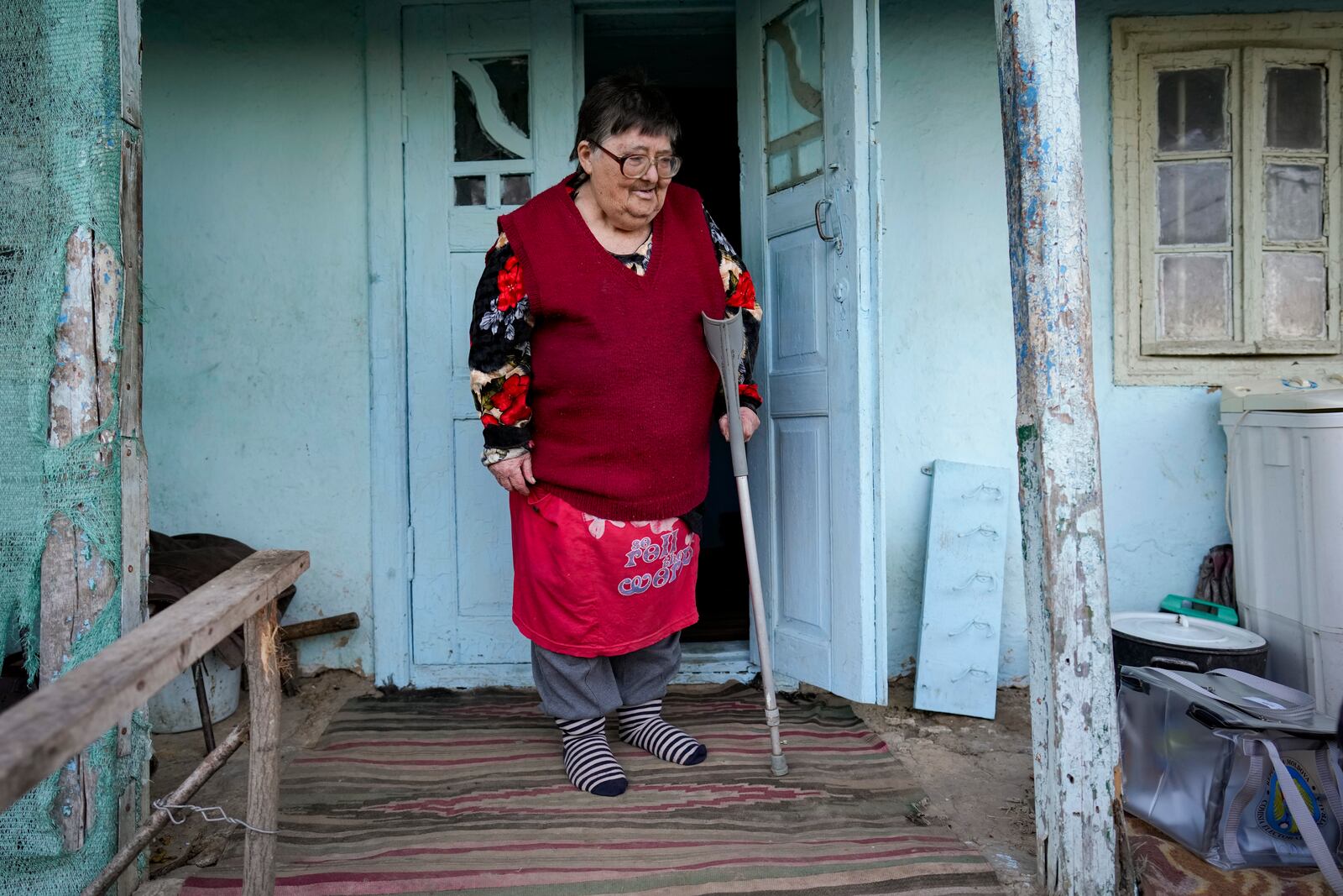 FILE - A woman looks at a mobile ballot box in the village of Ciopleni, Moldova, Sunday, Nov. 3, 2024. (AP Photo/Vadim Ghirda, File)