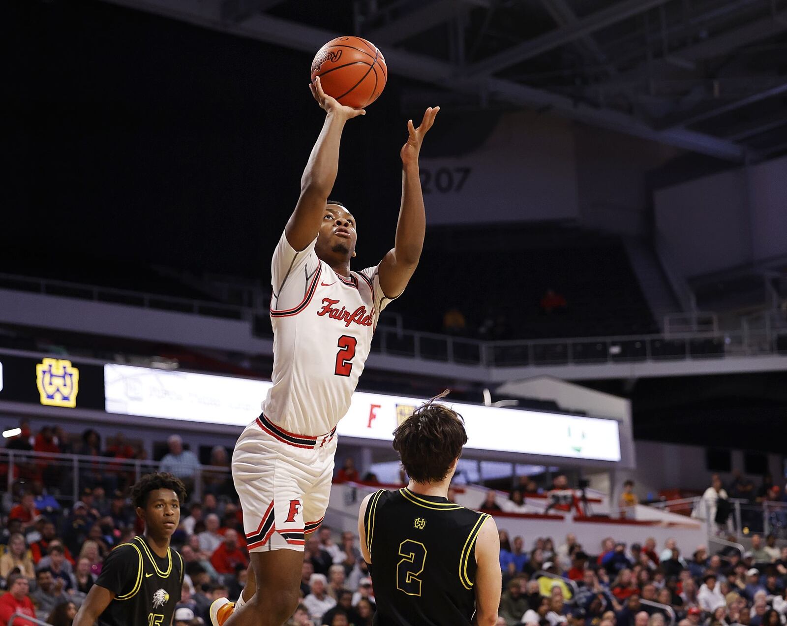 Fairfield's Deshawne Crim goes to the hoop over Walnut Hills guard Max Poynter during their Division I District final Sunday, March 6, 2022 at Fifth Third Arena on the University of Cincinnati campus. Fairfield won 55-52. NICK GRAHAM/STAFF