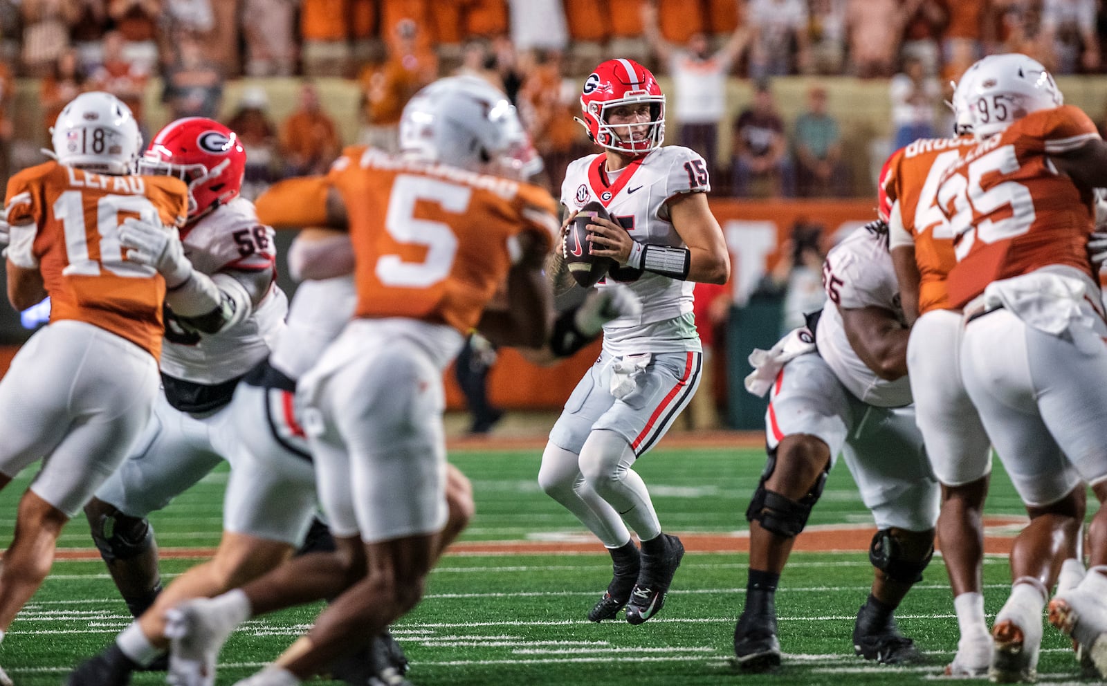 Georgia quarterback Carson Beck (15) looks down field for a receiver against Texas during the first half of an NCAA college football game in Austin, Texas, Saturday, Oct. 19, 2024. (AP Photo/Rodolfo Gonzalez)