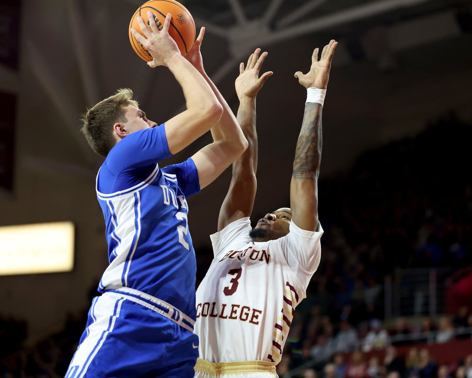 Duke guard Cooper Flagg (2) scores against Boston College guard Roger McFarlane (3) during the first half of an NCAA college basketball game Saturday, Jan. 18, 2025, in Boston. (AP Photo/Mark Stockwell)