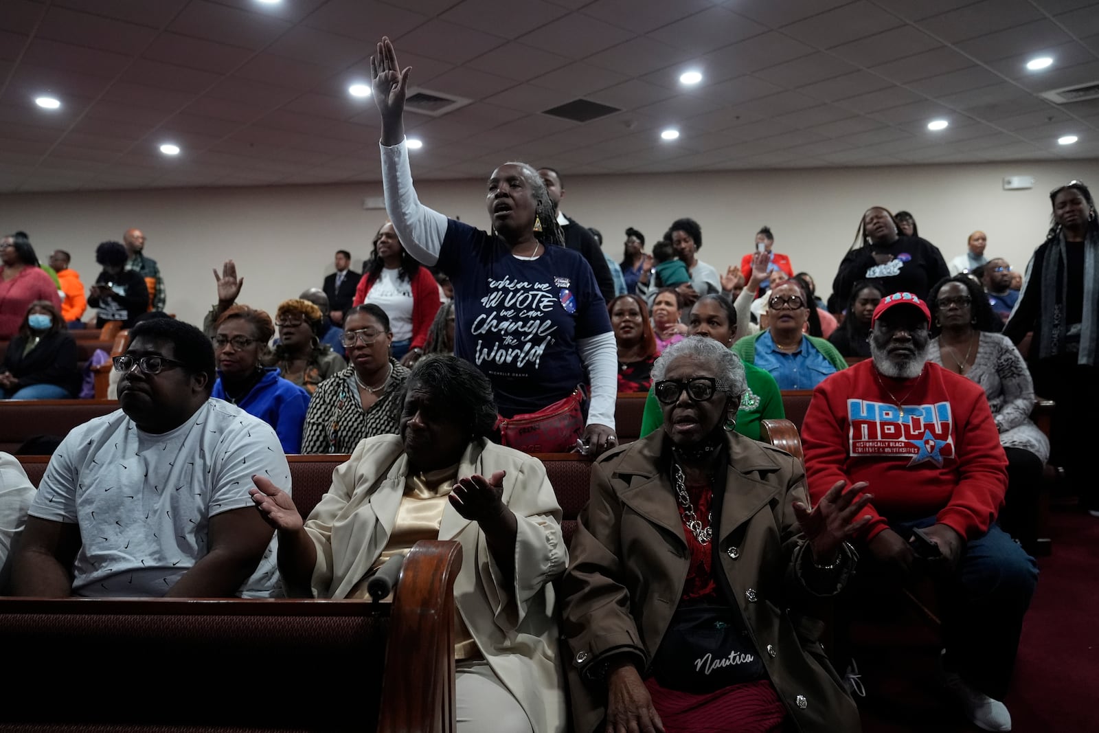 Members of the congregation pray before Democratic presidential nominee Vice President Kamala Harris arrives to speak during a service at the Church of Christian Compassion, Sunday, Oct. 27, 2024. (AP Photo/Susan Walsh)