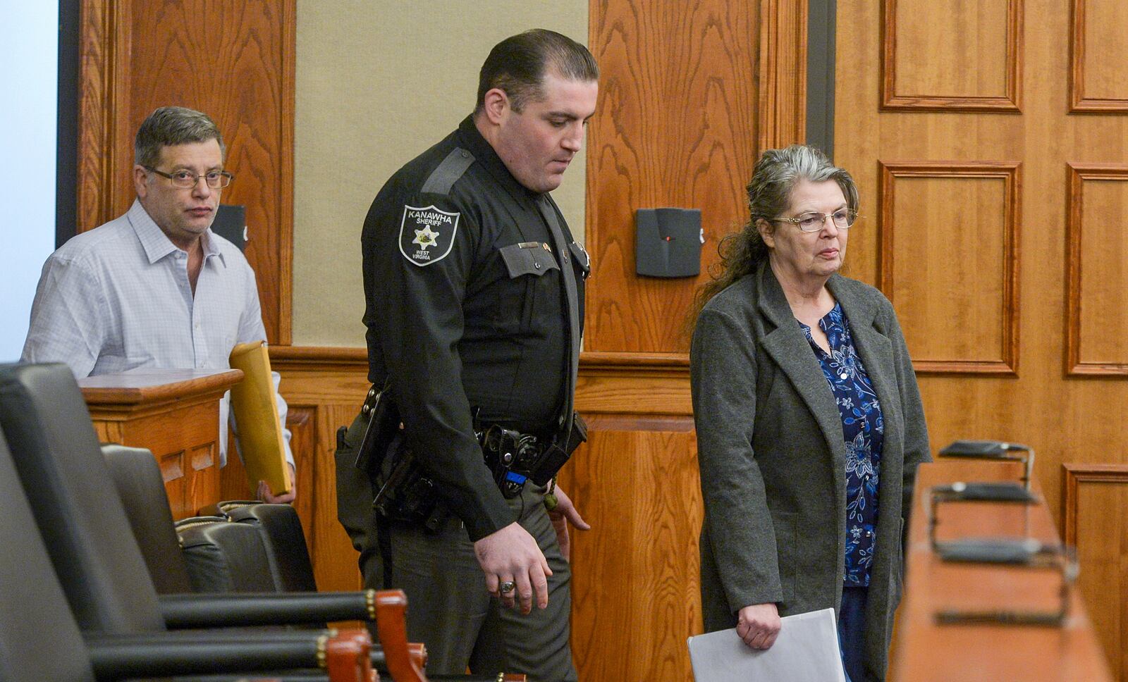 FILE - Defendants Donald Lantz, left, and Jeanne Whitefeather enter Kanawha Circuit Court with Kanawha County Sheriff Deputy Matthew Dingess for the first day of their trial, Tuesday, Jan. 14, 2025, in Charleston, W.Va. (Chris Dorst/Charleston Gazette-Mail via AP, File)