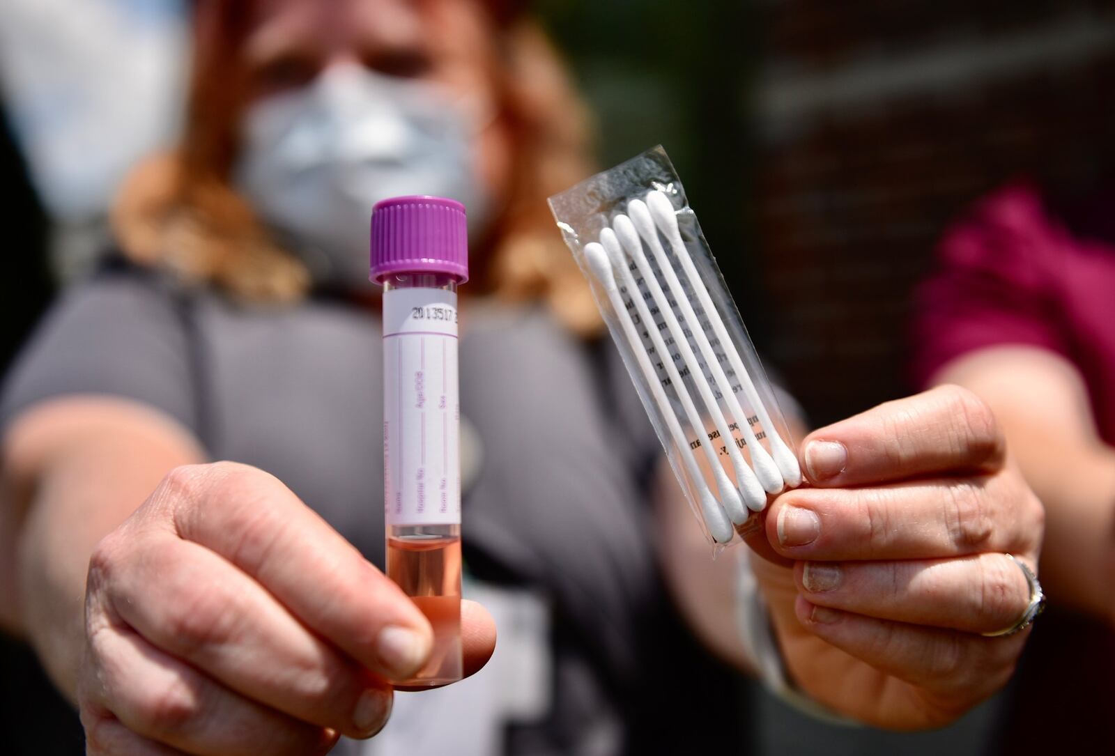 Medical assistant Carrie Bowman with Centerpoint Health on Breiel Boulevard in Middletown, shows a COVID-19 test kit outside the office Tuesday, June 16, 2020. Centerpoint Health will be on location at Robert “Sonny” Hill Community Center at 800 Lafayette Ave. in Middletown for testing today, June 17, 2020. NICK GRAHAM/STAFF