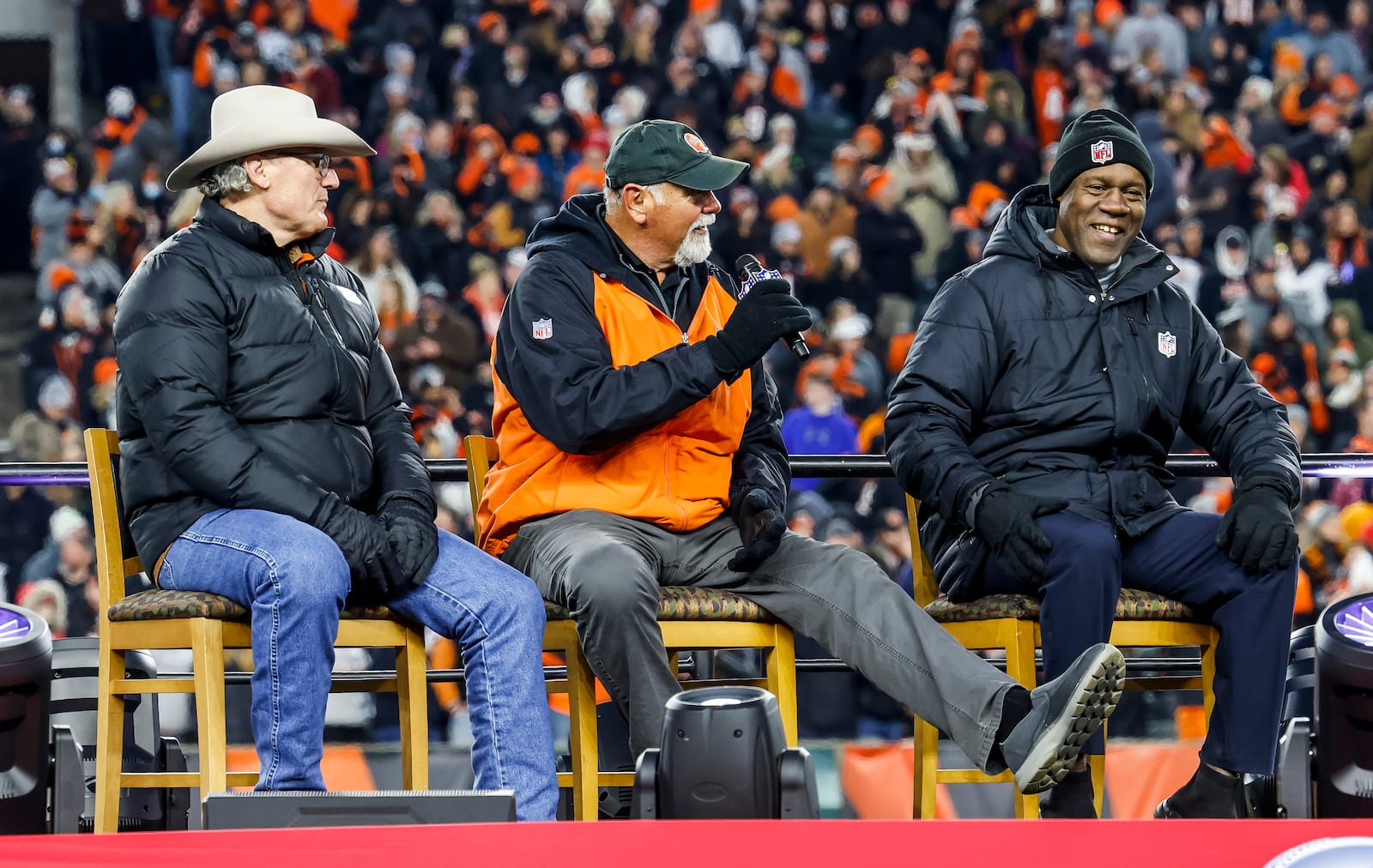 Former Cincinnati Bengals Tim Krumrie, Max Montoya and David Fulcher are interviewed on stage during the Super Bowl LVI Opening Night Fan Rally presented by Gatorade in support of the Cincinnati Bengals Monday, Feb. 7, 2022 at Paul Brown Stadium in Cincinnati. NICK GRAHAM/STAFF