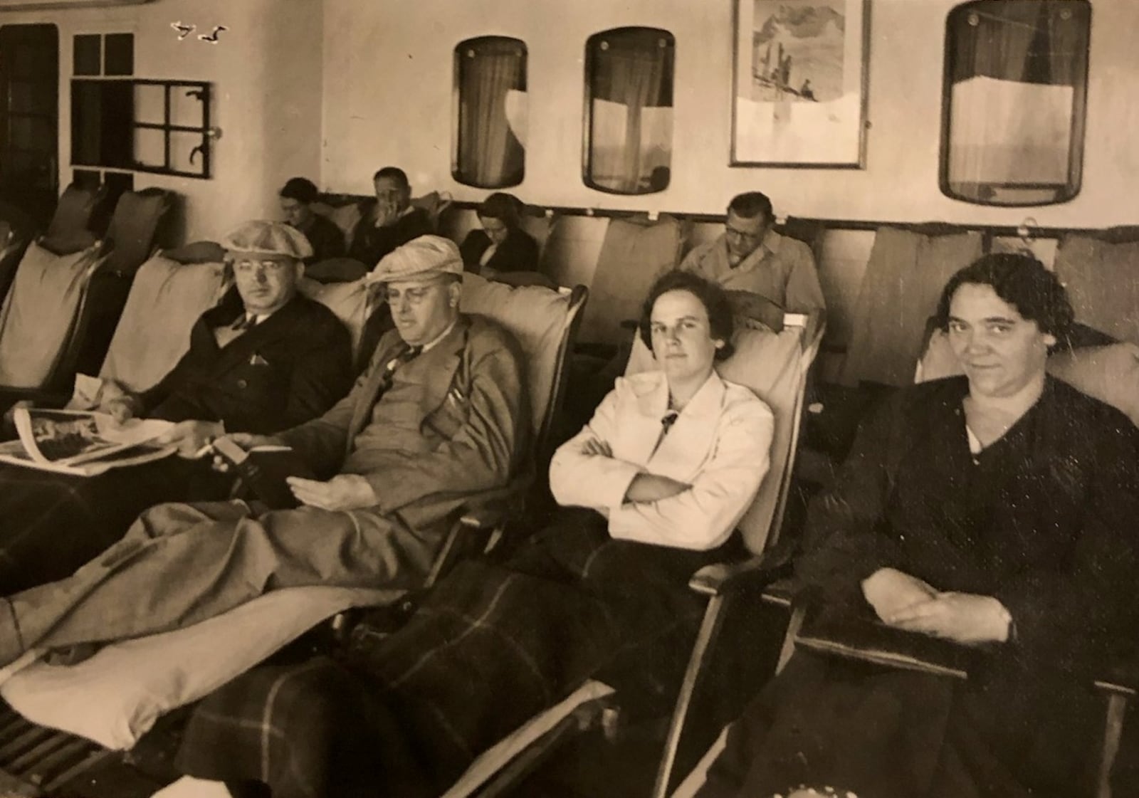 On board the ship which brought her to this country, Martha Engler wearing white jacket, second from right, rests with other passengers. They arrived here on the Fourth of July 1938 complete with a fireworks show on arrival. CONTRIBUTED