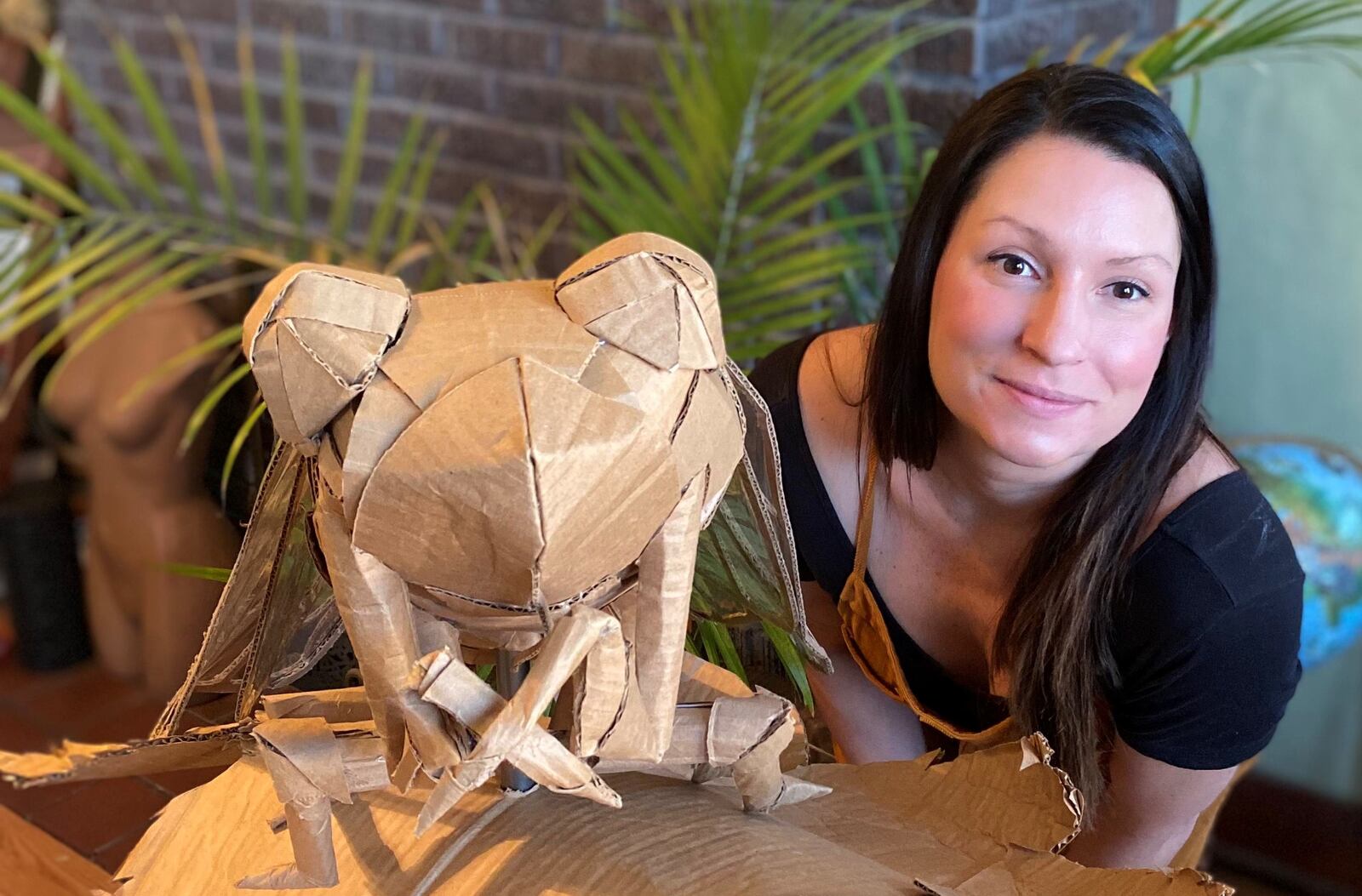 Leah Hughes is pictured with her award-winning “cicada” entry. Hughes was recently awarded a $500 cash prize for winning Saica Group’s “Sustainable Box Contest.” PROVIDED