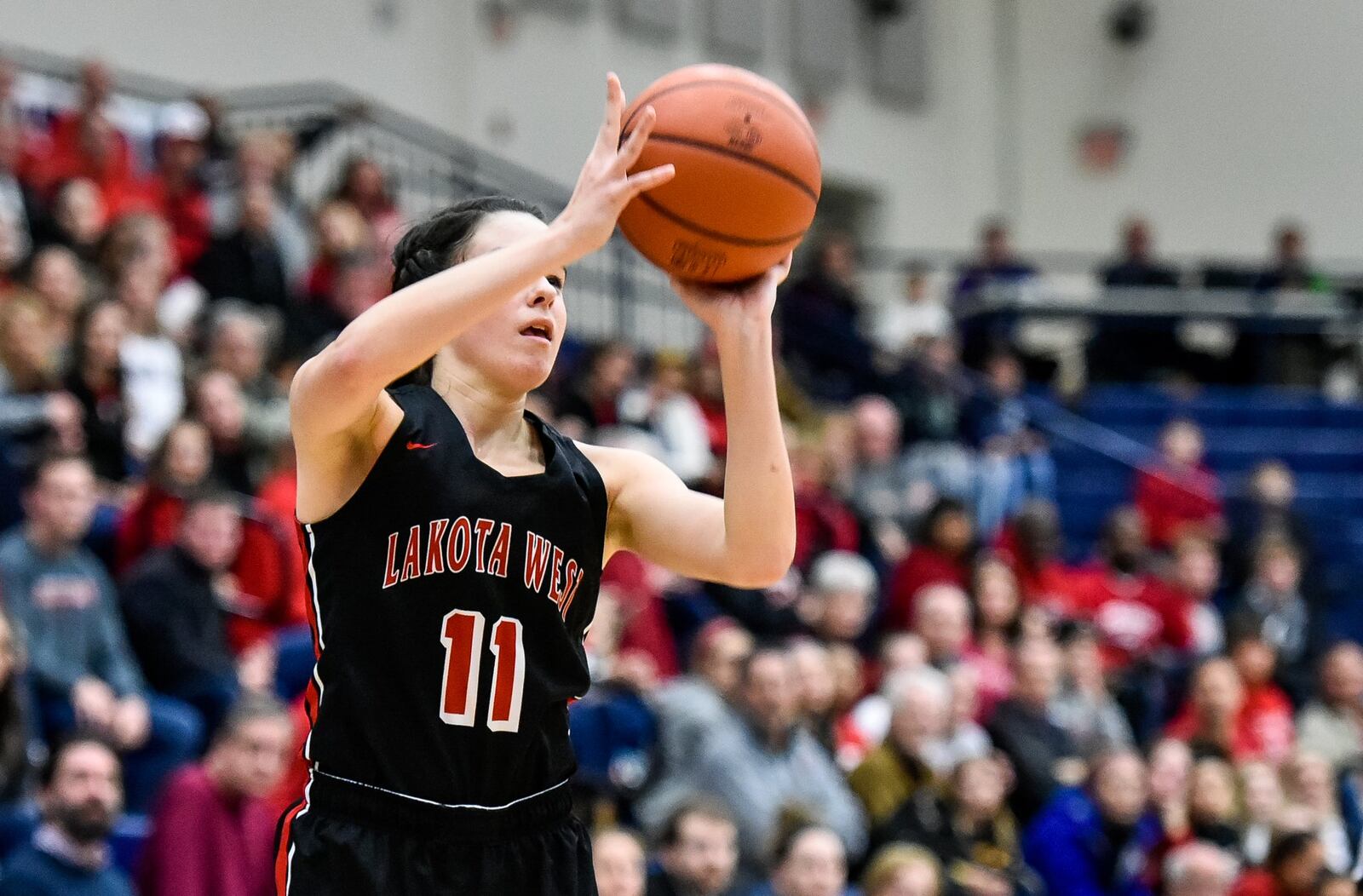 Lakota West’s Madisyn Oxley puts up a shot during Wednesday night’s Division I regional semifinal against Walnut Hills at Fairmont’s Trent Arena. West won 60-31. NICK GRAHAM/STAFF