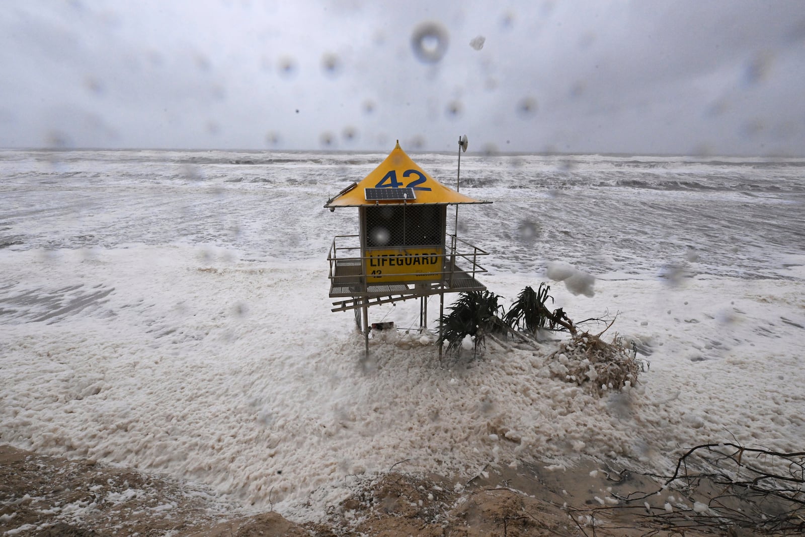 A lifeguard tower is surrounded by heavy seas following Cyclone Alfred on the Gold Coast, Australia, Saturday, March 8, 2025. (Dave Hunt/AAP Image via AP)