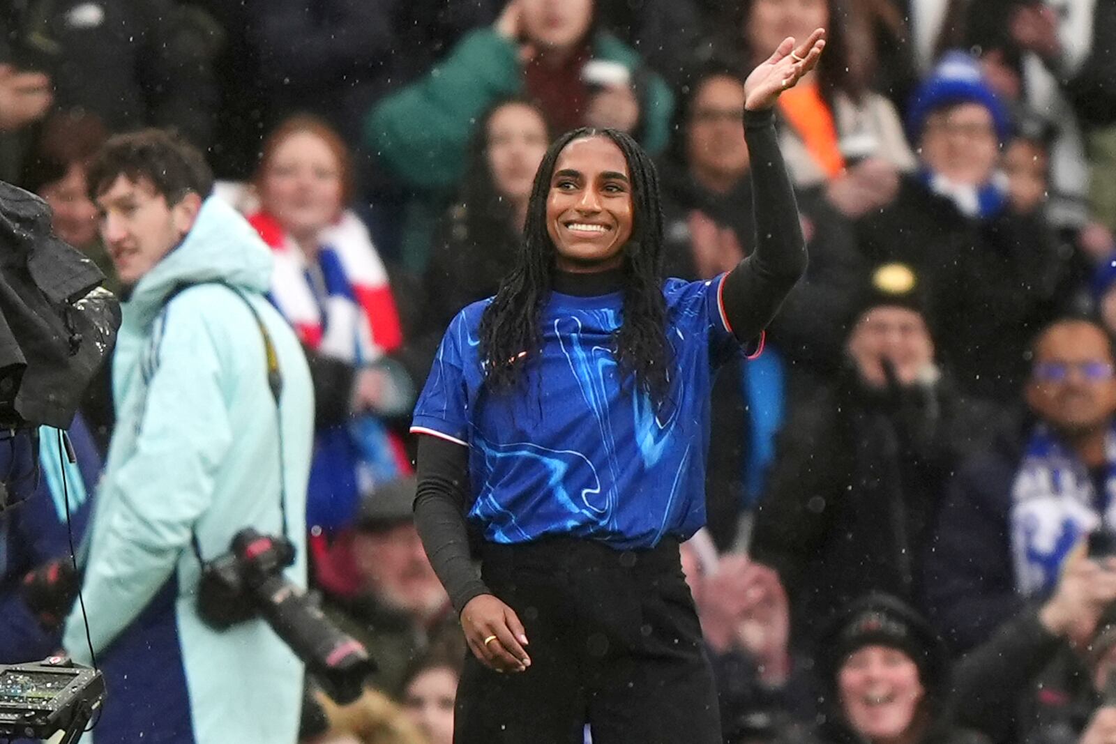 Chelsea new signing Naomi Girma is introduced to the fans ahead of the Women's Super League soccer match between Chelsea Women and Arsenal Women at Stamford Bridge, London, Sunday Jan. 26, 2025. (Bradley Collyer/PA via AP)