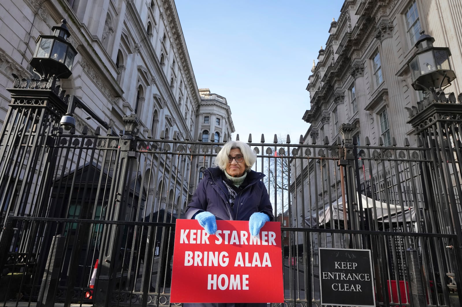 Leila Soueif, who has been on hunger strike for more than 129 days seeking the release of her son Alaa Abdel Fattah from prison in Egypt, stands outside Downing Street in London, Wednesday, Feb. 5, 2025. (AP Photo/Kirsty Wigglesworth)