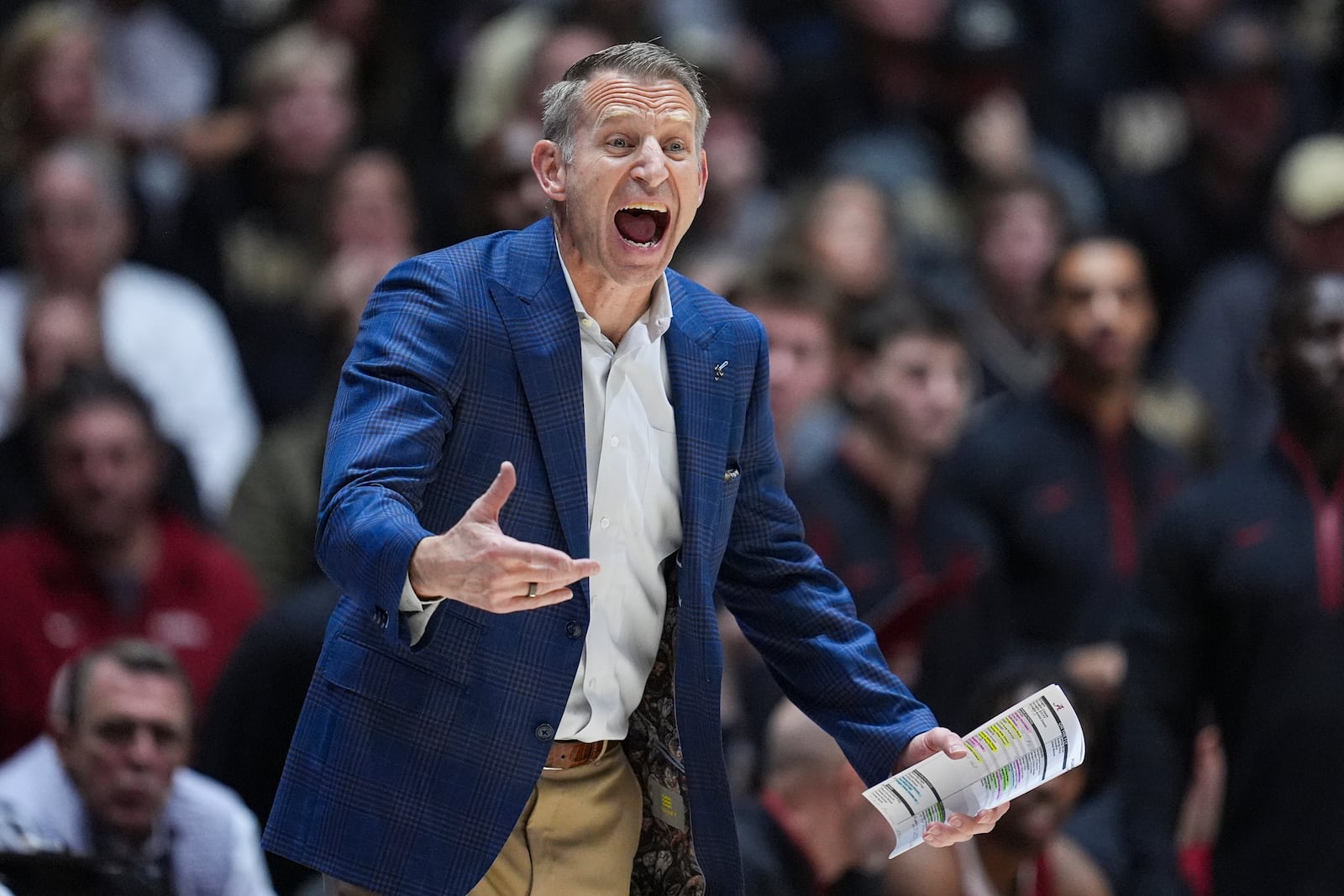 Alabama head coach Nate Oats yells to his team as they played against Purdue during the second half of an NCAA college basketball game in West Lafayette, Ind., Friday, Nov. 15, 2024. (AP Photo/Michael Conroy)