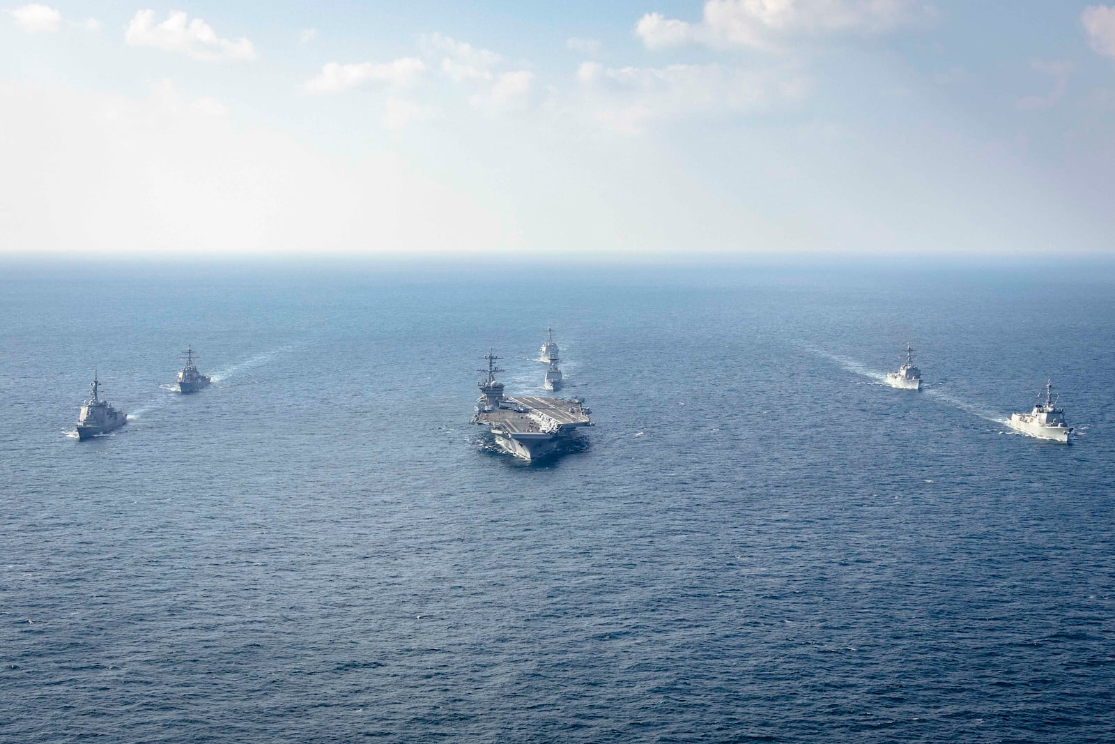 In this photo provided by South Korea Defense Ministry, warships of South Korea, the United States and Japan including the USS George Washington aircraft carrier, bottom center, take part in the trilateral Freedom Edge exercise in international waters off South Korea's southern island of Jeju, Wednesday, Nov. 13, 2024. (South Korea Defense Ministry via AP)