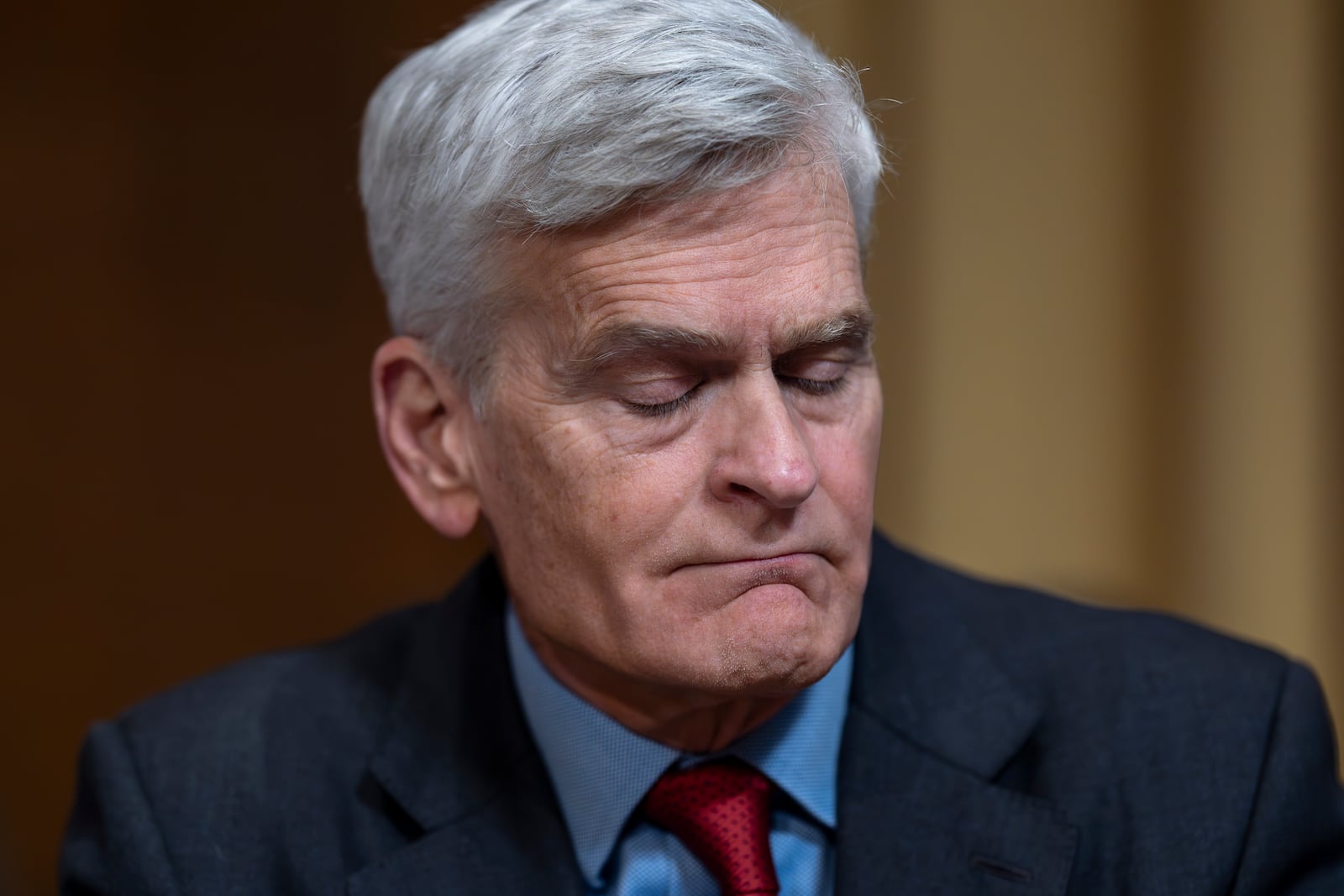 Sen. Bill Cassidy, R-La., pauses just after voting aye as the Senate Finance Committee holds a roll call to approve the nomination of Robert F. Kennedy Jr. to lead the Health and Human Services Department, at the Capitol in Washington, Tuesday, Feb. 4, 2025. (AP Photo/J. Scott Applewhite)