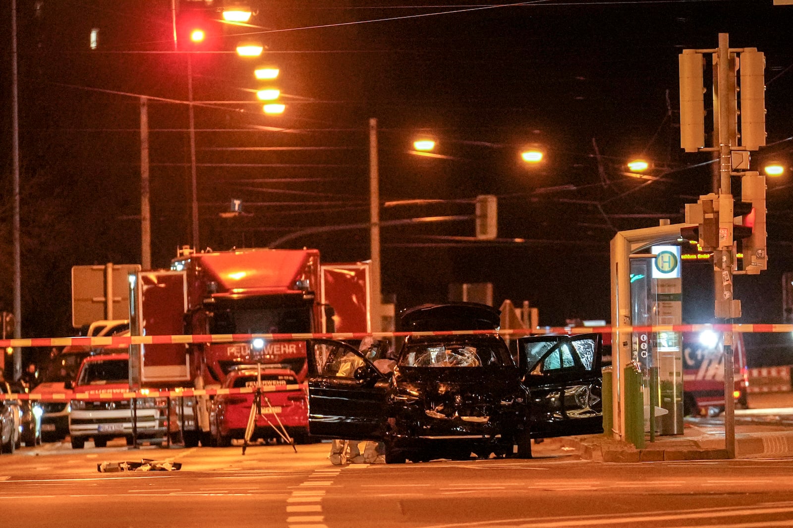 The car that was crashed into a crowd of people at the Magdeburg Christmas market is seen following the attack in Magdeburg, Germany, Saturday early morning, Dec. 21, 2024. (AP Photo/Ebrahim Noroozi)