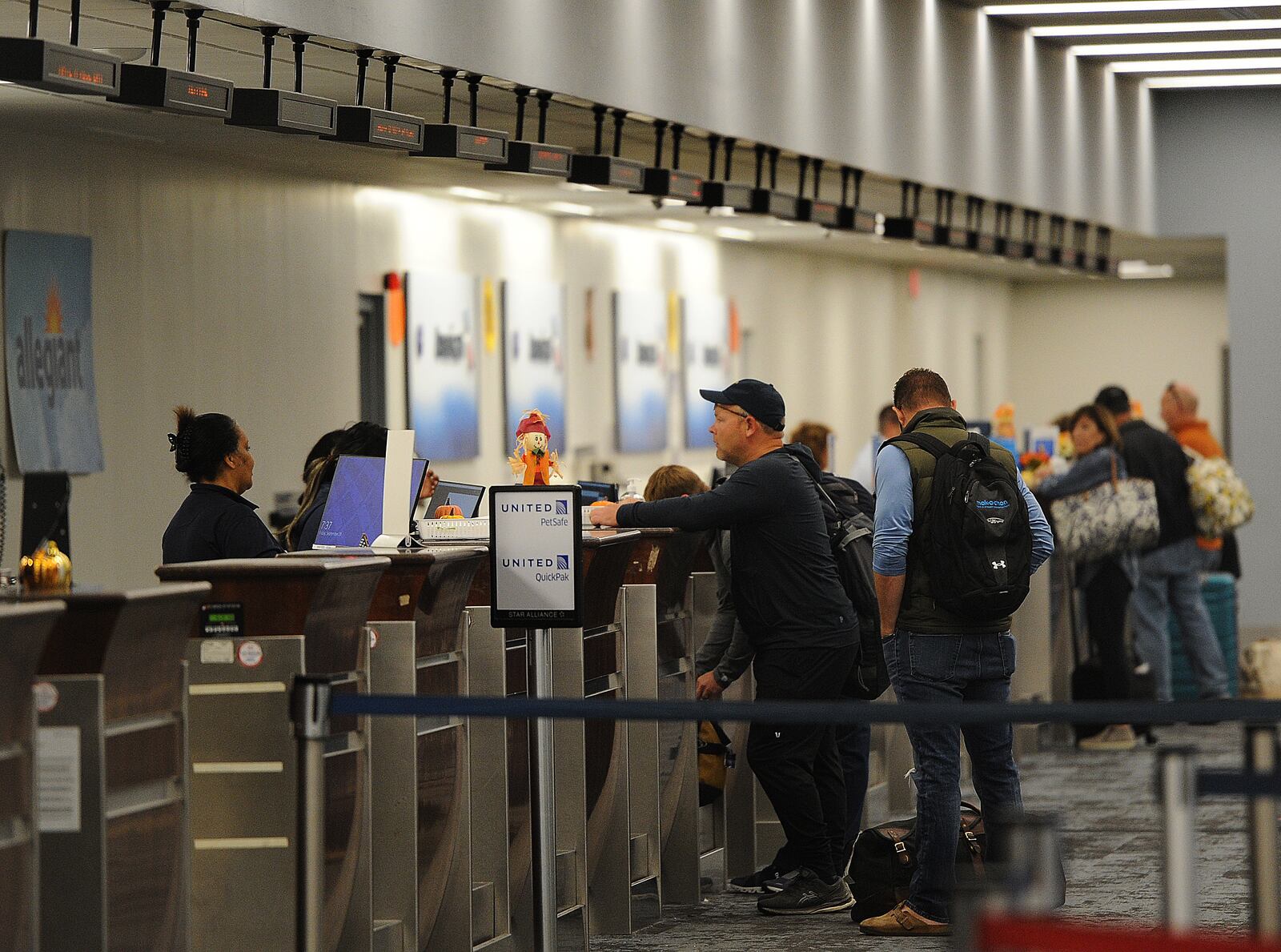 Travelers at the Dayton International Airport check in before their flight. Airports are expected to be busier than usual from the day before Thanksgiving until the Sunday after the holiday with nearly 232,000 Ohioans expected to travel by airplane, according to AAA. MARSHALL GORBY/STAFF