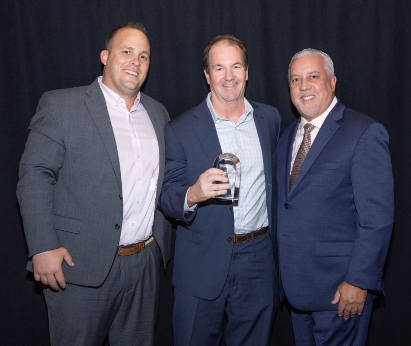 The Gilligan Company has been named the 2022 Dunkin’ Operator of the Year. Pictured (left to right) is Gilligan Brand President Travis Sensabaugh, COO of Gilligan Brands Chris Zimmerman and COO of Dunkin’, Inspire Brands Rick Colón .