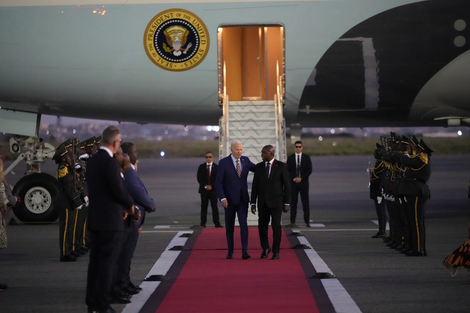 President Joe Biden is greeted by Angolan Foreign Minister Tete Antonio as he arrives at Quatro de Fevereiro international airport in the capital Luanda, Angola on Monday, Dec. 2, 2024, on his long-promised visit to Africa. (AP Photo/Ben Curtis)