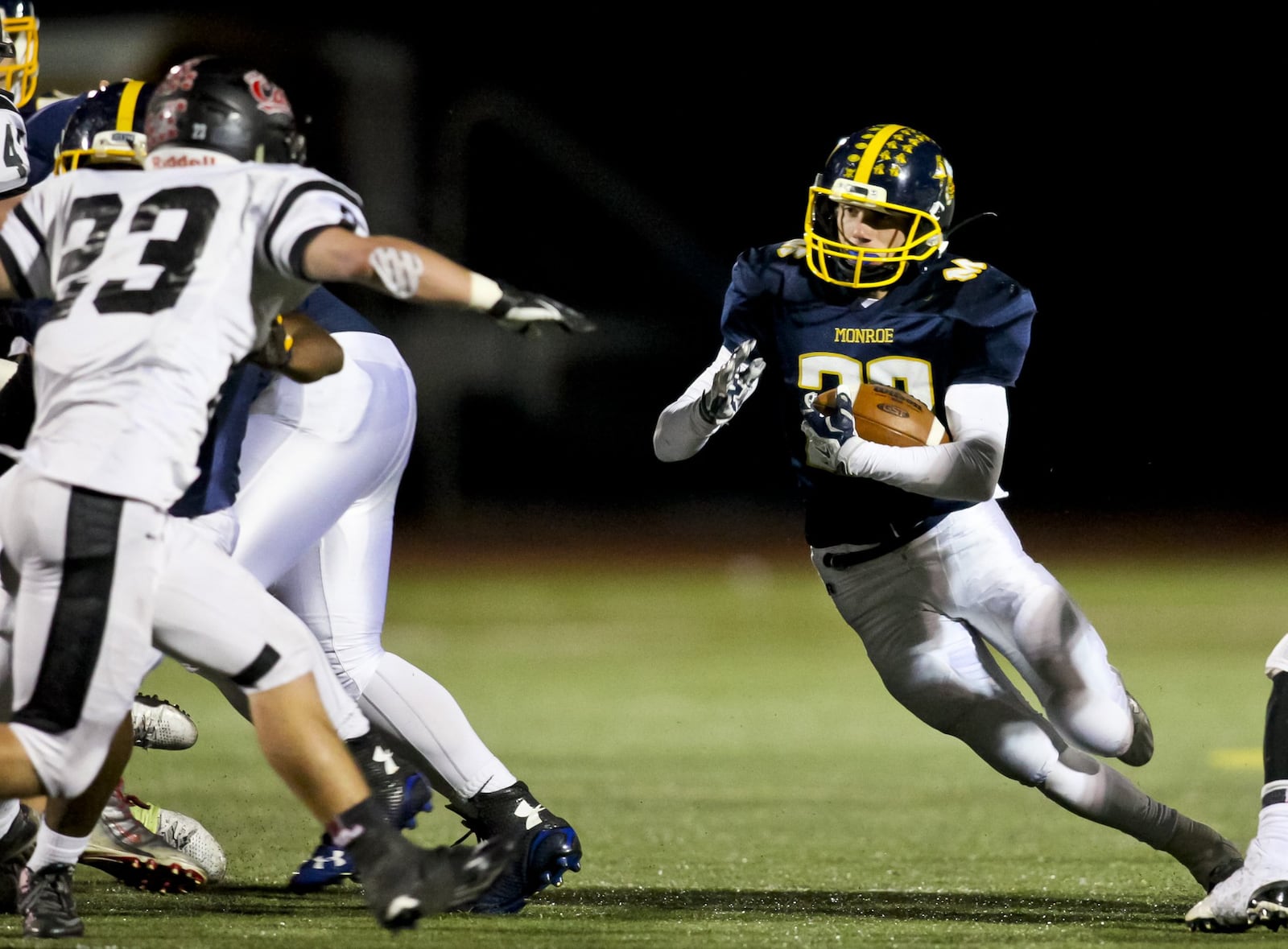 Monroe’s Jacob Vires carries the ball during a game against visiting Franklin on Oct. 16, 2015. NICK GRAHAM/STAFF