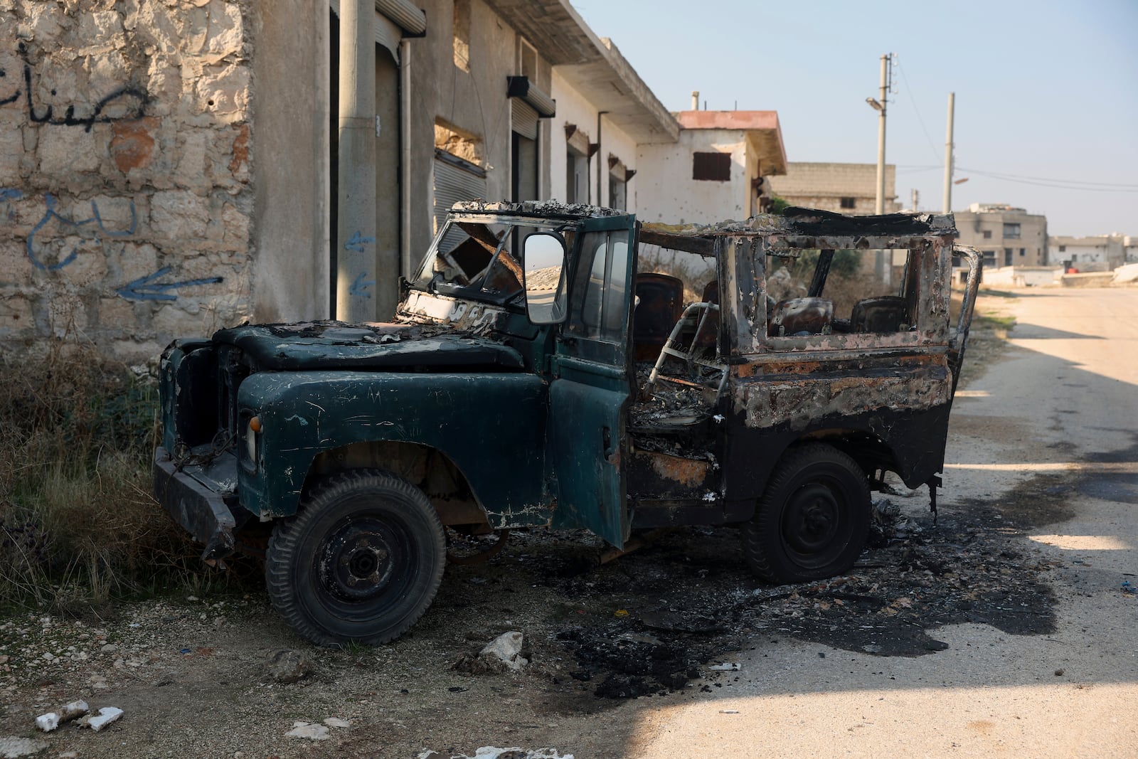 A damaged vehicle belonging to the Syrian Government troops, seen in Kafr Halab, Aleppo countryside, Syria, Friday, Nov. 29, 2024. (AP Photo/Ghaith Alsayed)