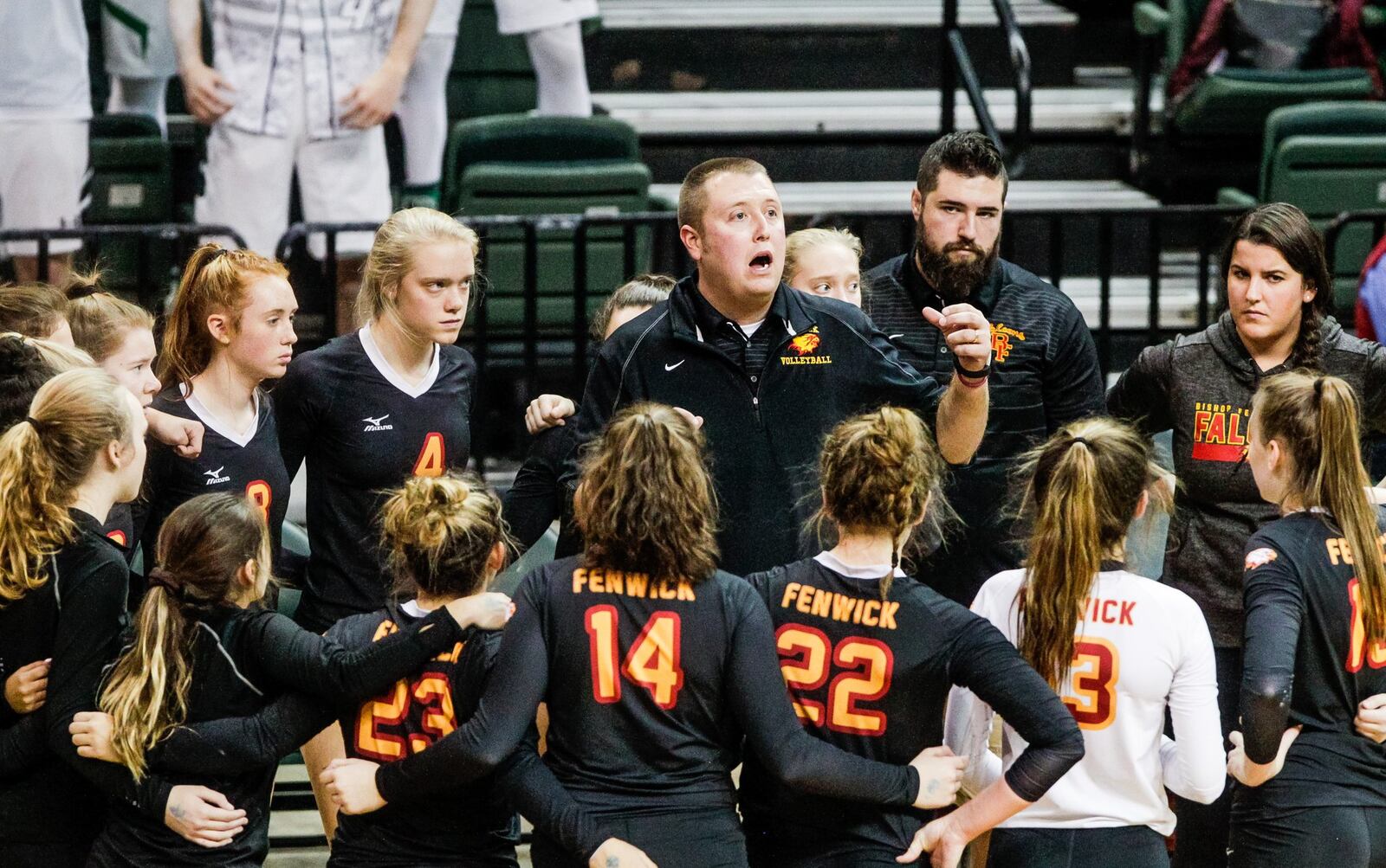 Fenwick coach Tyler Conley talks to his team during a timeout in Friday’s Division II state volleyball semifinal against Parma Heights Holy Name at Wright State University’s Nutter Center. NICK GRAHAM/STAFF