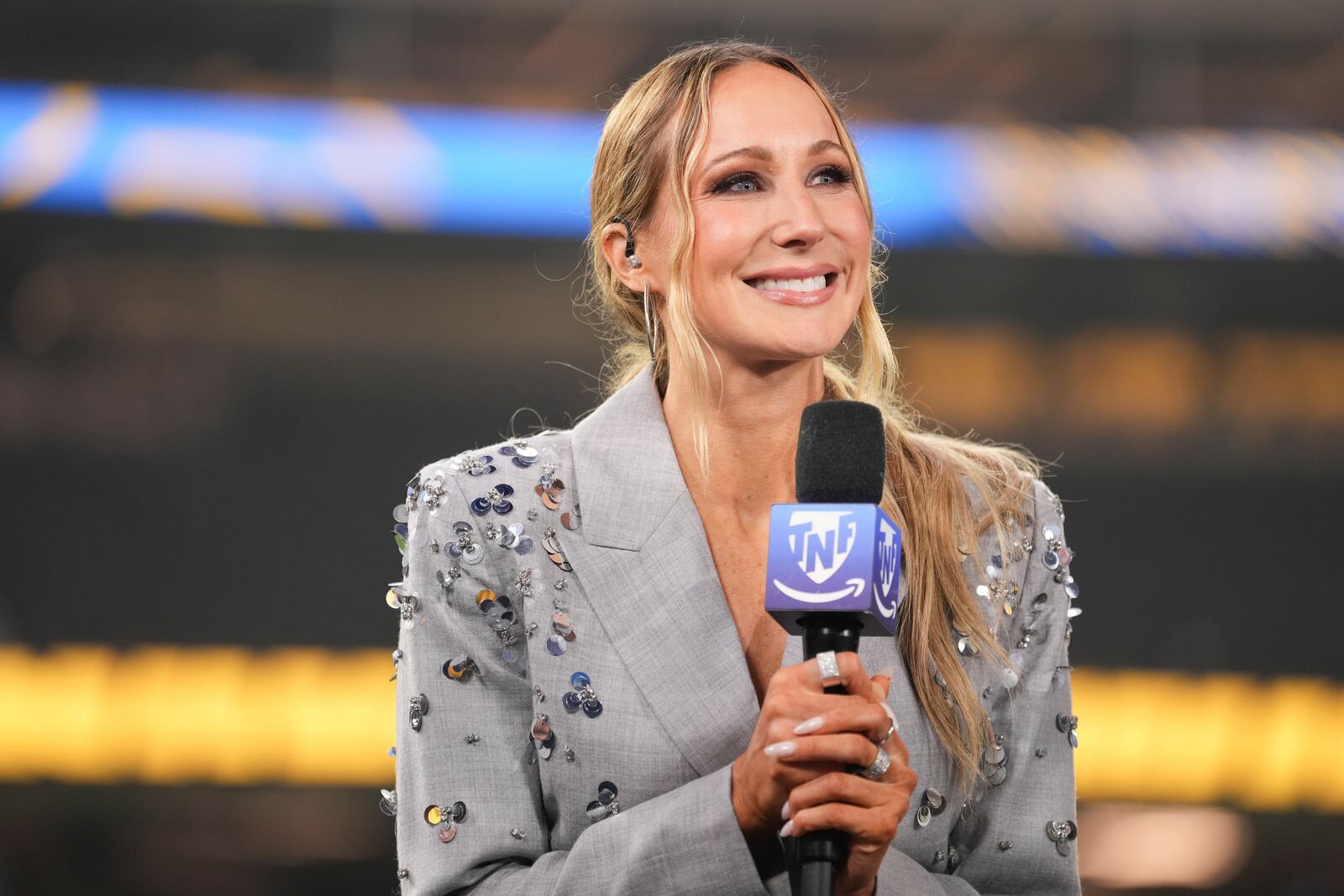 Nikki Glaser participates in a segment after an NFL football game between the Los Angeles Chargers and the Denver Broncos, Thursday, Dec. 19, 2024, in Inglewood, Calif. (AP Photo/Eric Thayer)