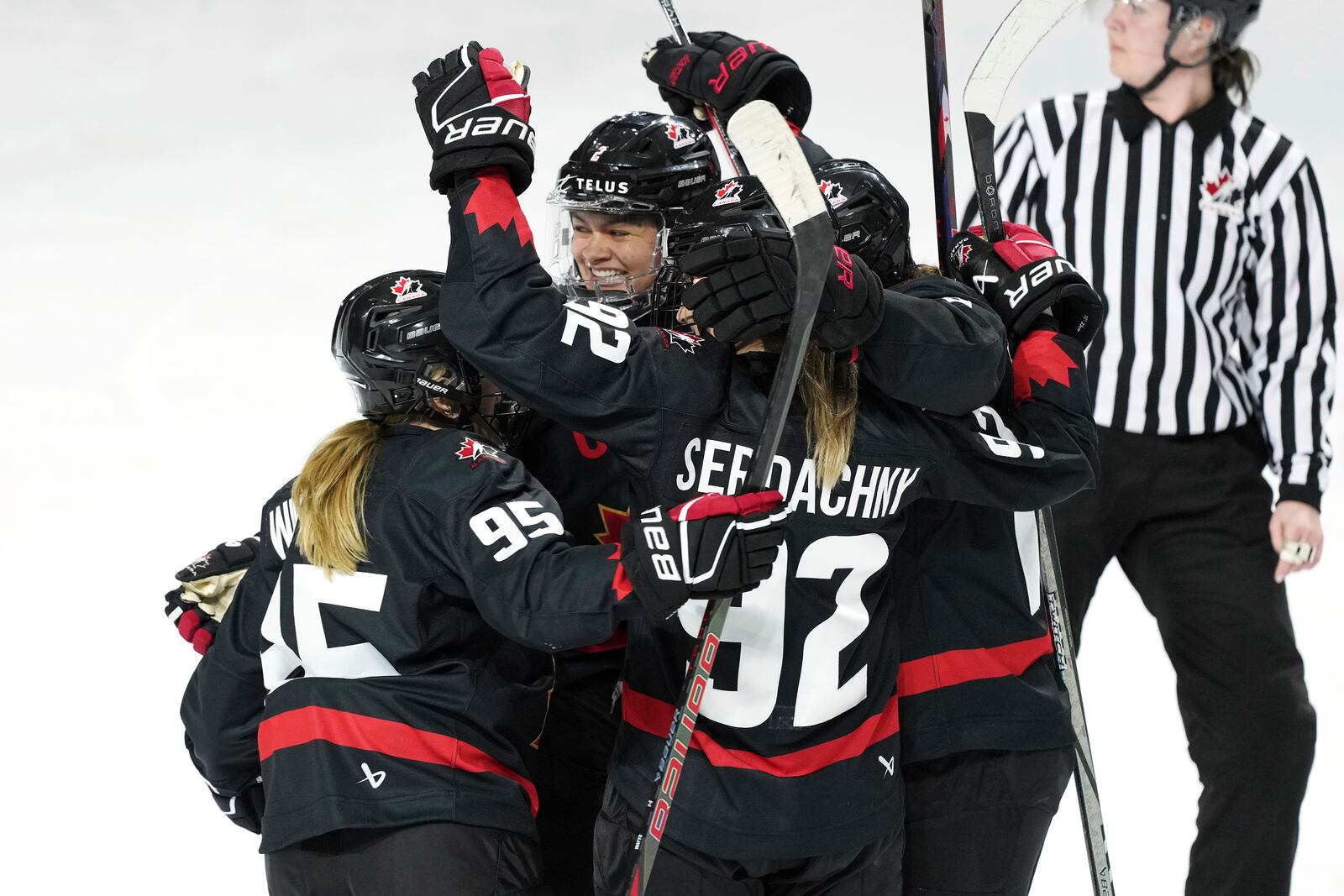 Members of Team Canada celebrate a goal against the United States during the second period of a Rivalry Series hockey game in Summerside, Prince Edward Island, Canada, Saturday, Feb. 8, 2025. (Darren Calabrese/The Canadian Press via AP)