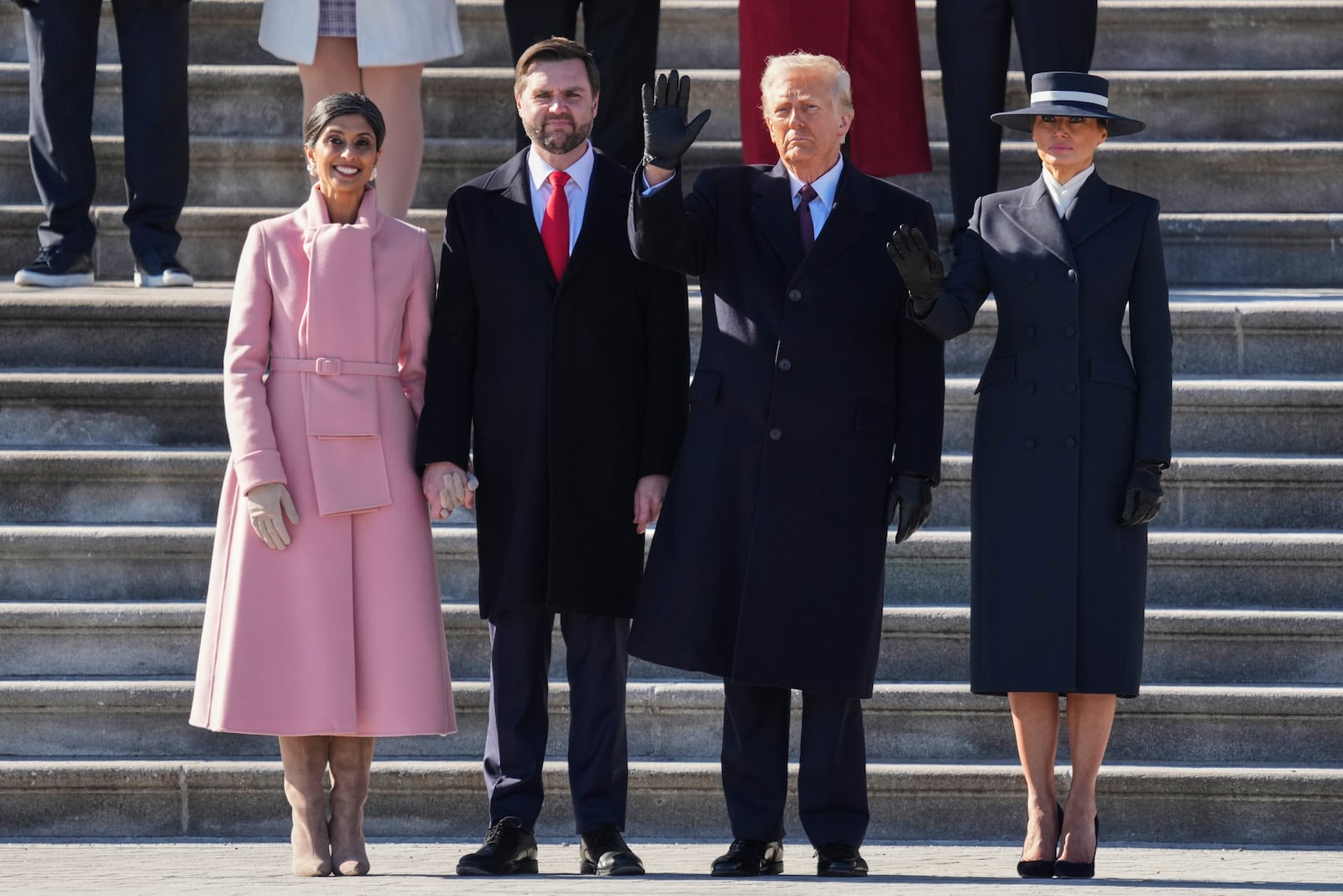 Second lady Usha Vance, left, Vice President JD Vance, second from left, President Donald Trump, second from right, and first lady Melania Trump look on as the Bidens depart to Joint Base Andrews on a Marine helicopter after the 60th Presidential Inauguration, Monday, Jan. 20, 2025, at the U.S. Capitol in Washington. (Chris Kleponis/Pool Photo via AP)