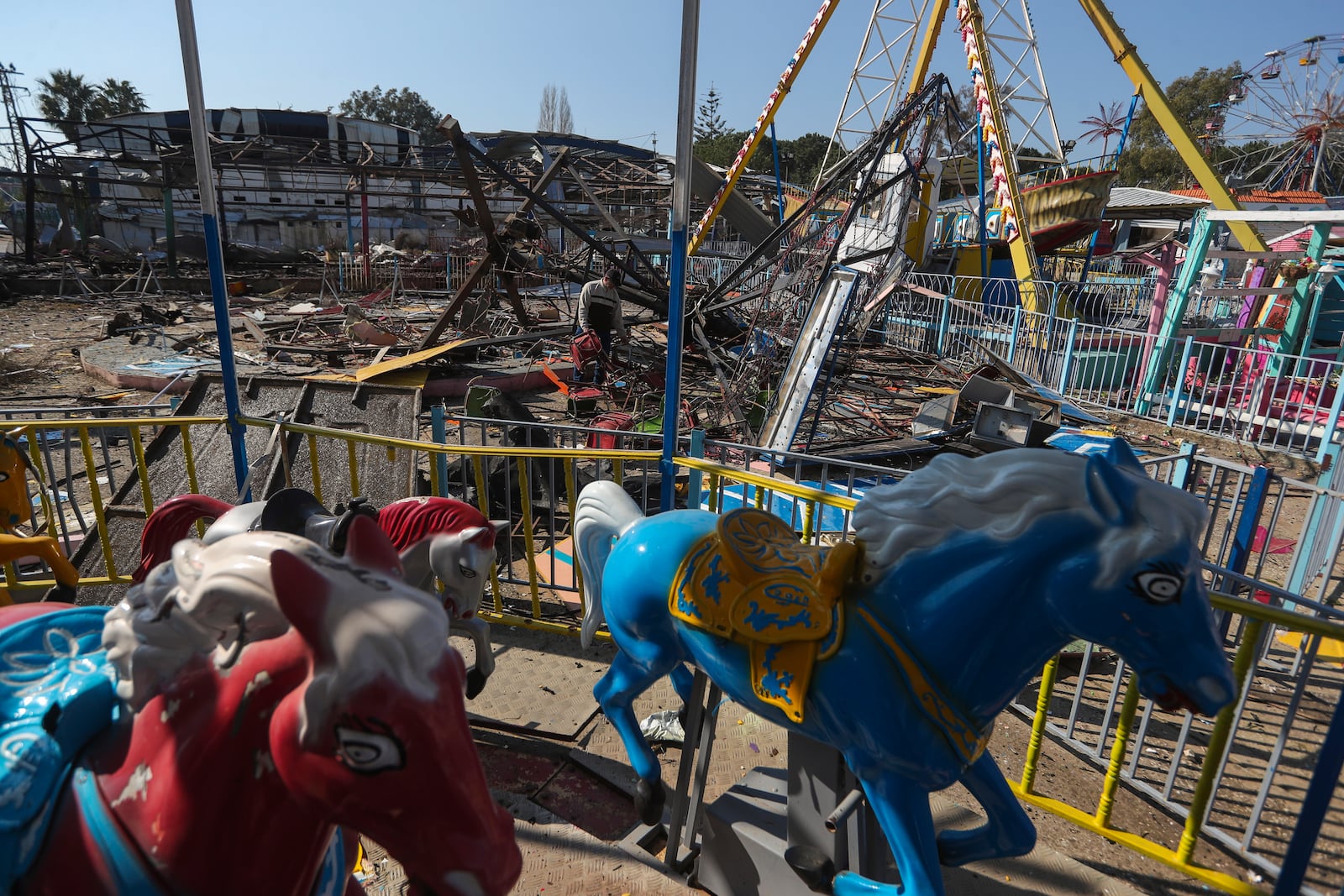 A man looks at the damages at an amusement park that was hit Tuesday night by an Israeli airstrike, in Nabatiyeh town, southern Lebanon, Wednesday, Jan. 29, 2025. (AP Photo/Mohammed Zaatari)