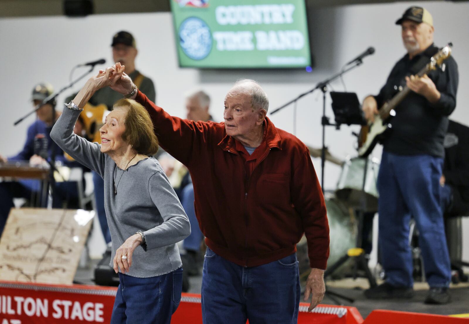 Barry Moran and Ruth Templeton dance to the music of Standard Country Time Band at Pohlman Lanes Wednesday, Jan. 12, 2022 in Hamilton. Pohlman Lanes has turned some of their bowling lanes into multi-use space with a stage, tables and room for dancing and other activities. NICK GRAHAM / STAFF