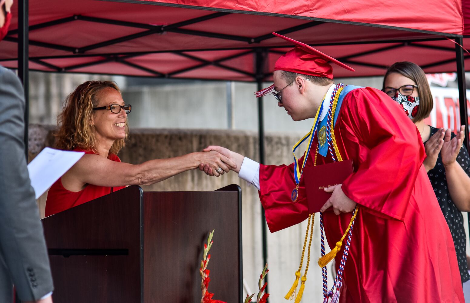 Madison High School drive-thru graduation ceremony at Land of Illusion