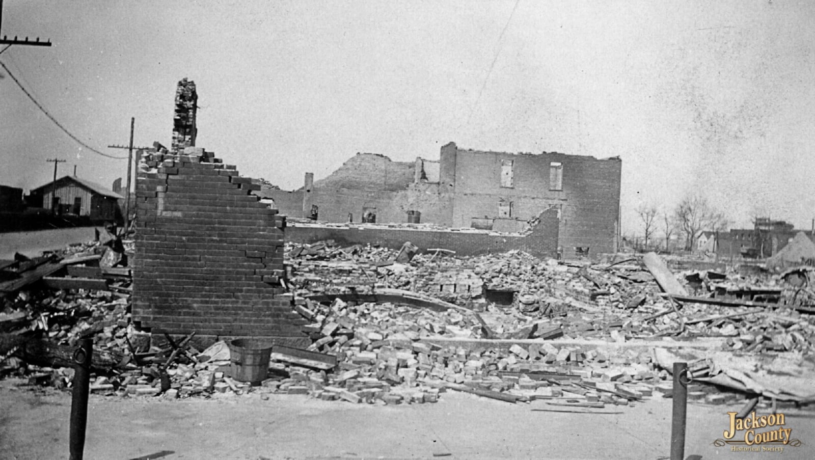 This photo provided by the Jackson County (Ill.) Historical Society shows 17th and Walnut Streets, close to the Mobile and Ohio rail yards, with the freight house in background, in Murphysboro, Ill., after a tornado tore through Indiana, Illinois, and Missouri in March 1925. (Jackson County (Ill.) Historical Society via AP)