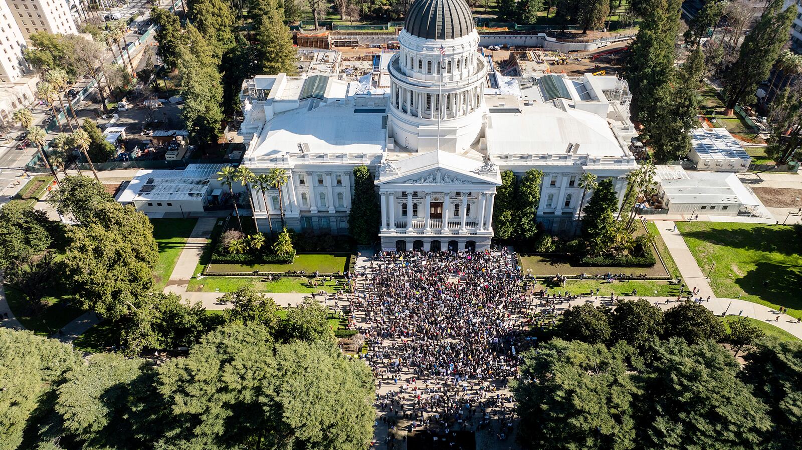 Several hundred demonstrators rally against President Donald Trump outside the California State Capitol on Wednesday, Feb. 5, 2025, in Sacramento, Calif. (AP Photo/Noah Berger)