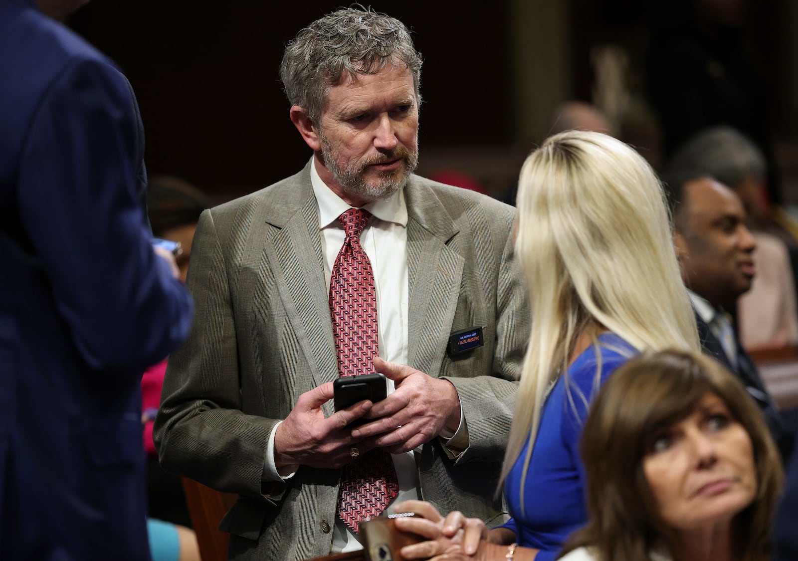 Rep. Thomas Massie, R-Ky., left, talks to Rep. Marjorie Taylor Greene, R-Ga., right, before President Donald Trump addresses a joint session of Congress at the Capitol in Washington, Tuesday, March 4, 2025. (Win McNamee/Pool Photo via AP)