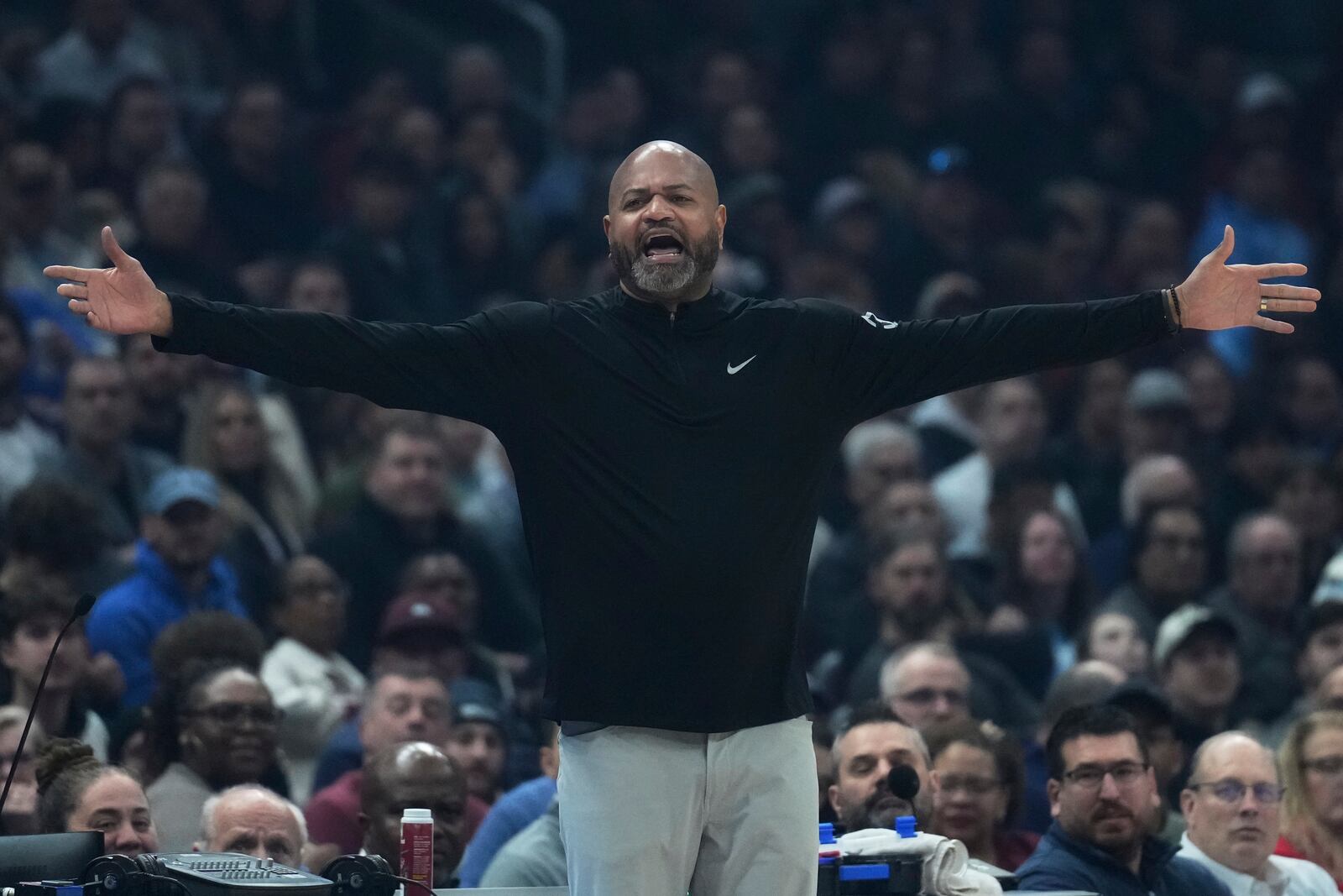 Detroit Pistons head coach J.B. Bickerstaff gestures in the first half of an NBA basketball game against the Cleveland Cavaliers, Monday, Jan. 27, 2025, in Cleveland. (AP Photo/Sue Ogrocki)